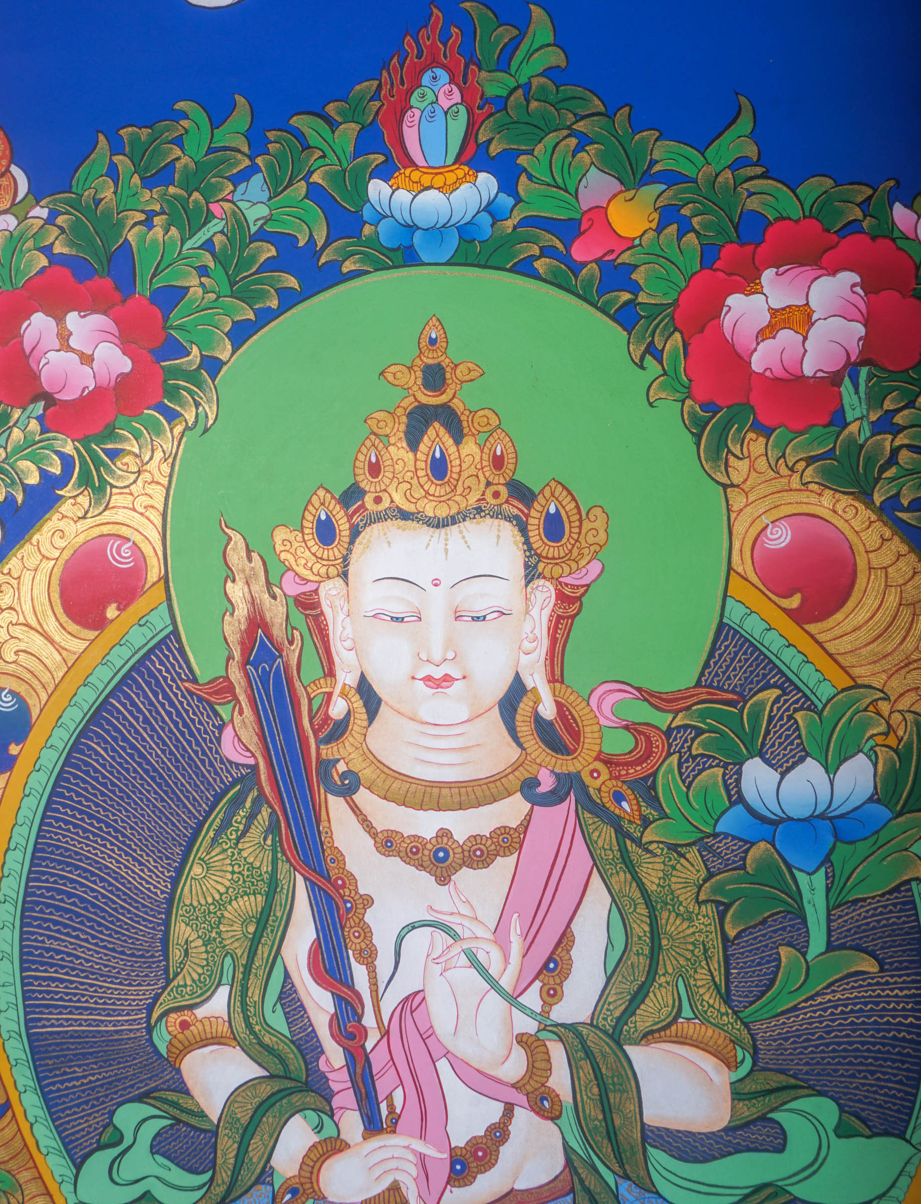 Handmade Thangka Painting of Manjushri embodies the essence of wisdom that dispels the darkness of ignorance