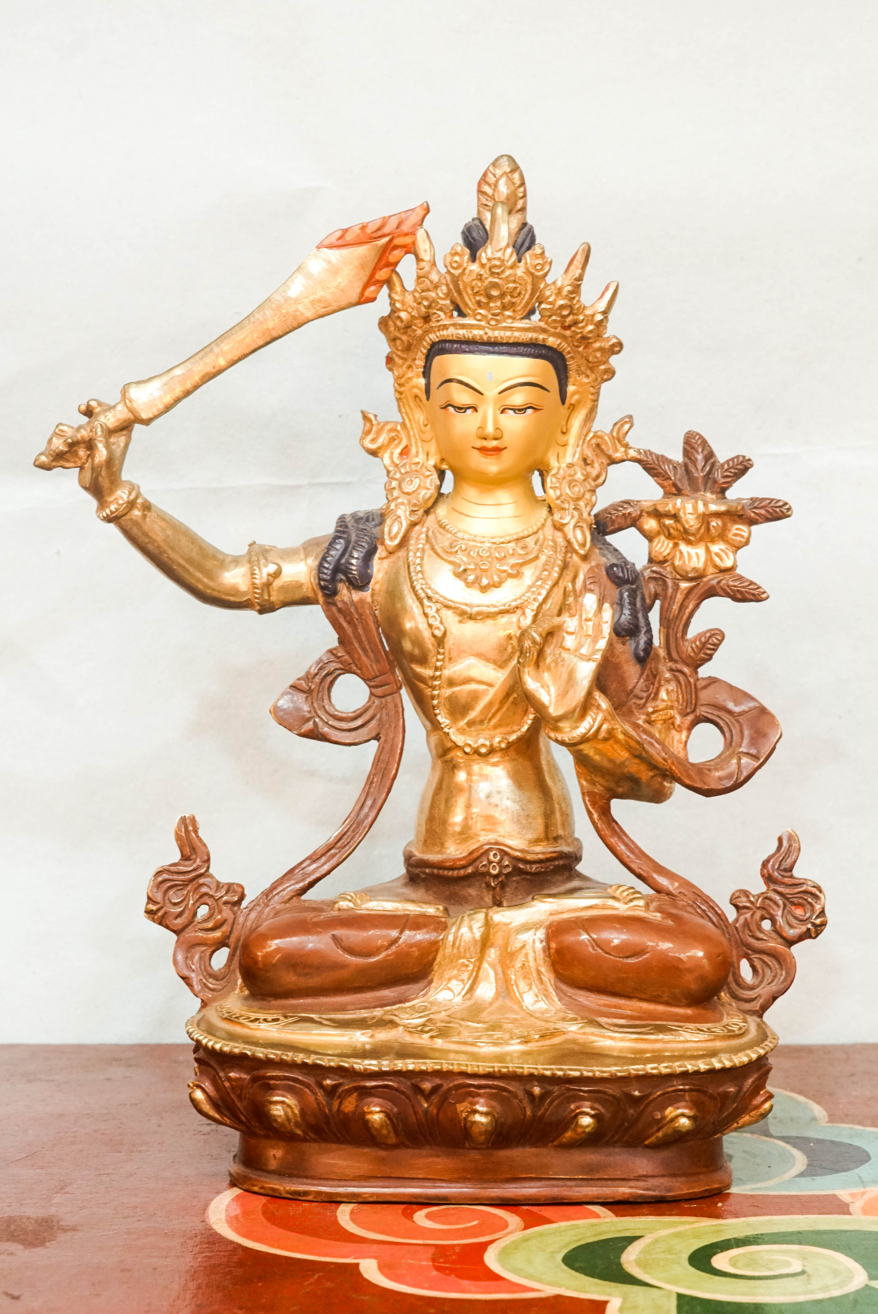 Statue of Manjushri, the Bodhisattva of Wisdom, depicting serene and powerful qualities; used as a spiritual object for meditation, altar decoration, or meaningful gifting.