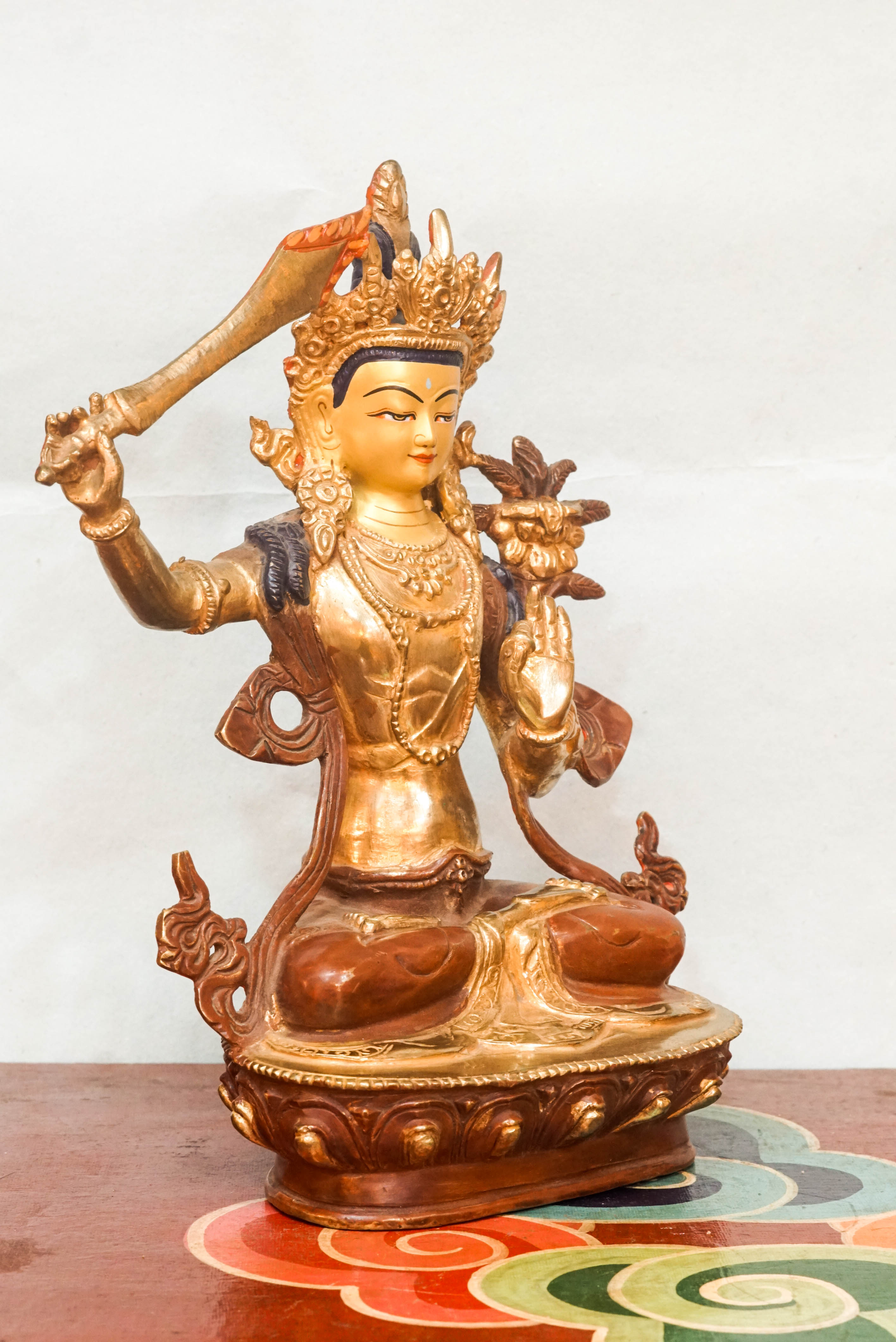 Statue of Manjushri, the Bodhisattva of Wisdom, depicting serene and powerful qualities; used as a spiritual object for meditation, altar decoration, or meaningful gifting.