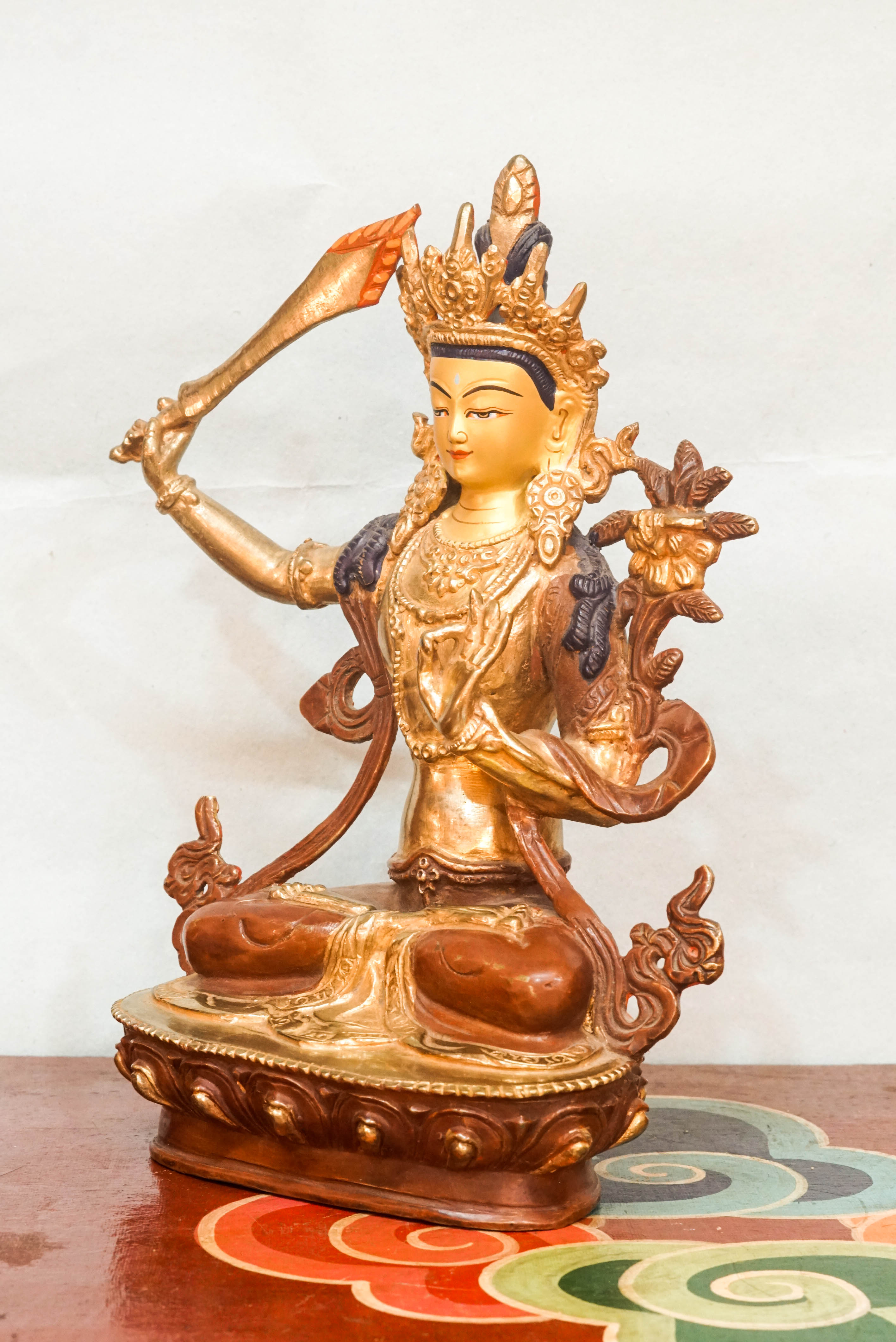 Statue of Manjushri, the Bodhisattva of Wisdom, depicting serene and powerful qualities; used as a spiritual object for meditation, altar decoration, or meaningful gifting.