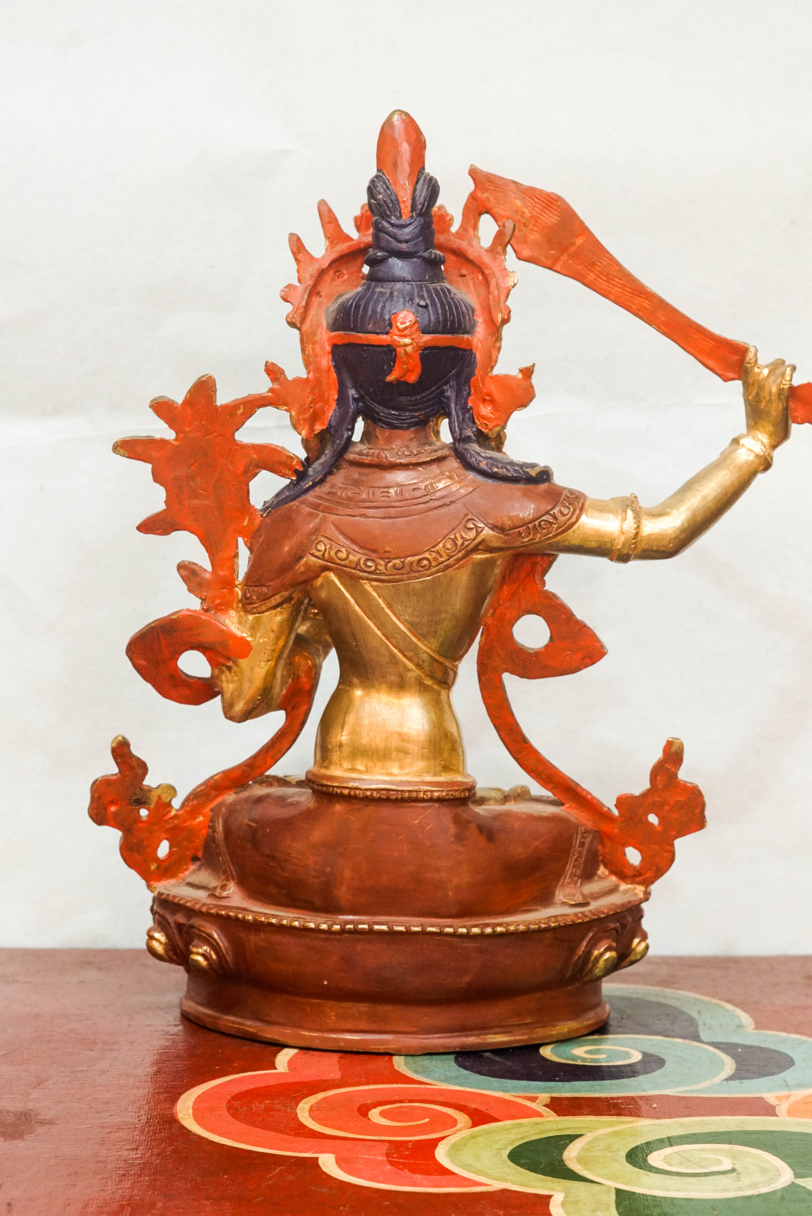 Statue of Manjushri, the Bodhisattva of Wisdom, depicting serene and powerful qualities; used as a spiritual object for meditation, altar decoration, or meaningful gifting.