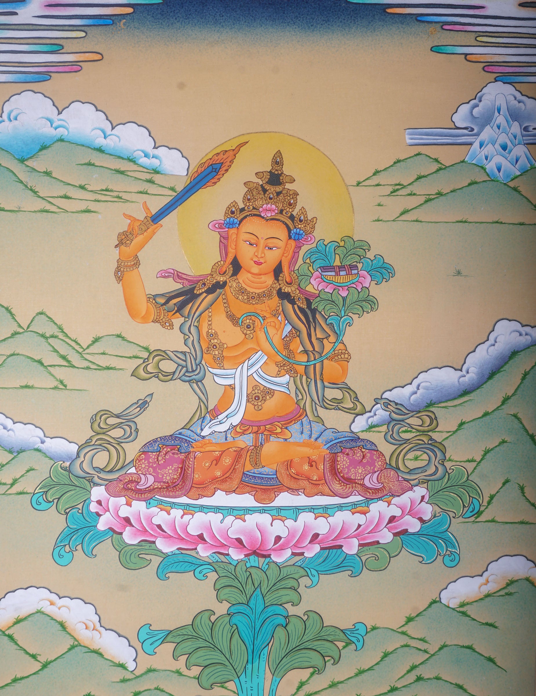 This genuine Tibetan Thangka of Manjushri is a hand-painted Buddhist masterpiece that symbolizes enlightened wisdom and clarity. Crafted with natural pigments, it’s ideal for spiritual spaces, guiding seekers on the path to higher understanding.