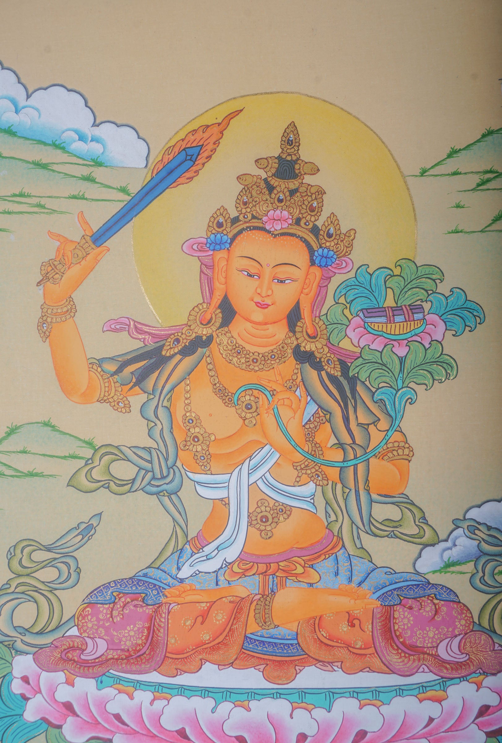 This genuine Tibetan Thangka of Manjushri is a hand-painted Buddhist masterpiece that symbolizes enlightened wisdom and clarity. Crafted with natural pigments, it’s ideal for spiritual spaces, guiding seekers on the path to higher understanding.