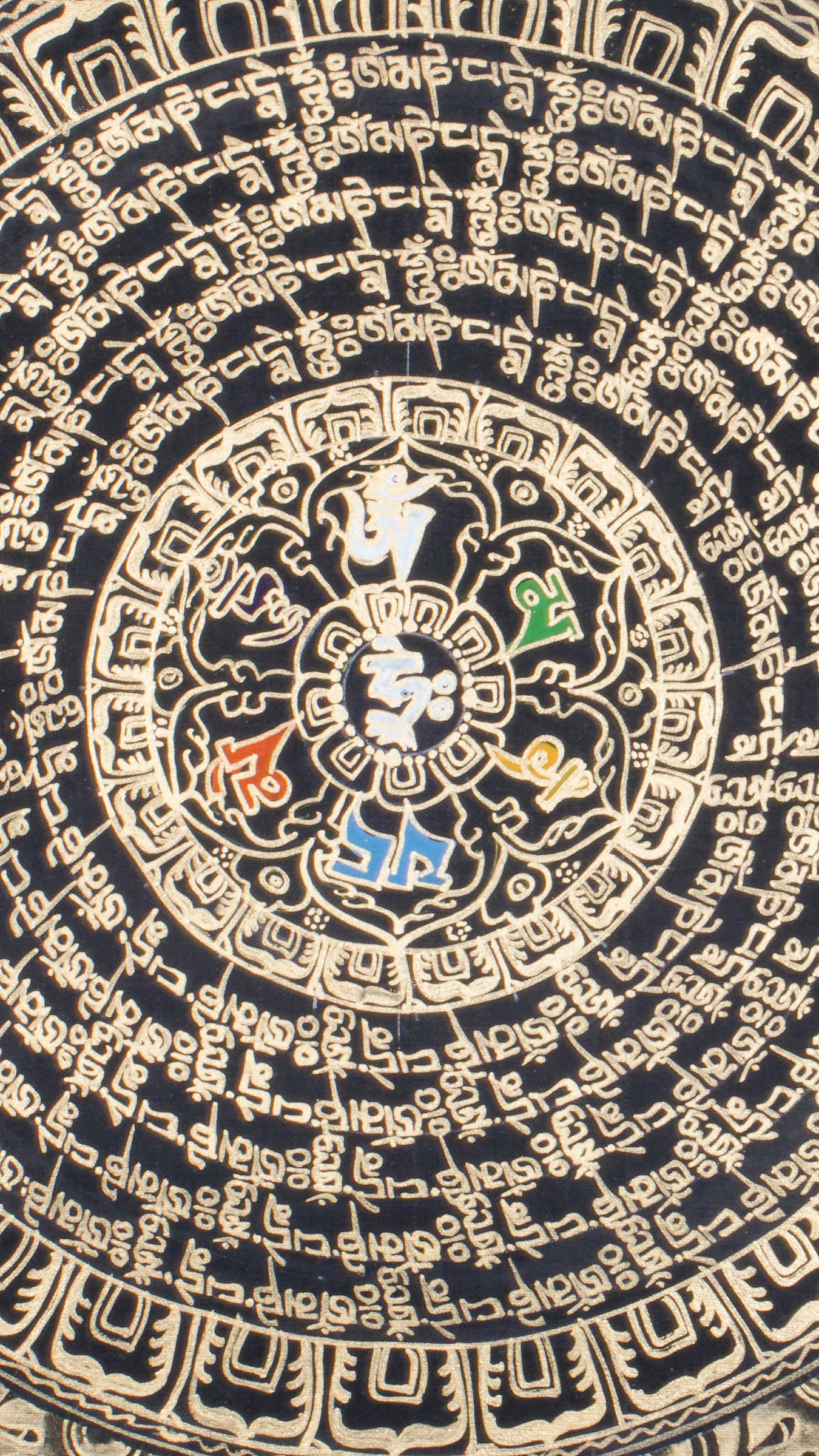 Tibetan mantra mandala thangka with concentric rings of sacred script surrounding a central symbol, framed by dragons and ornate gold detailing on a black background.