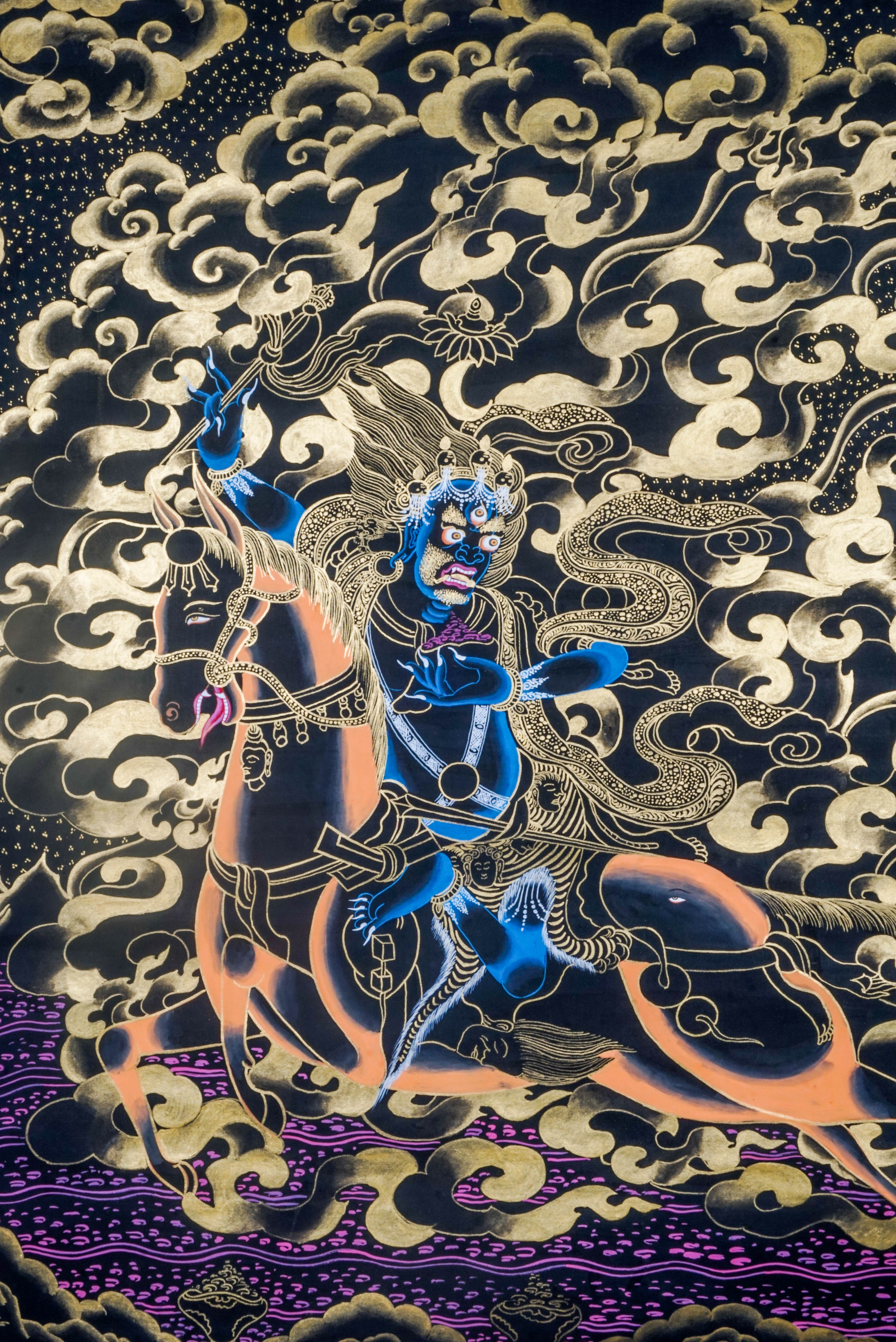 Palden Lhamo is a fierce protector deity in Tibetan Buddhism, symbolizing strength and the safeguarding of the Dharma. This vibrant Thangka, crafted with traditional techniques and gold leaf, captures her powerful energy and serves as a potent focus for meditation and spiritual protection in any sacred space.