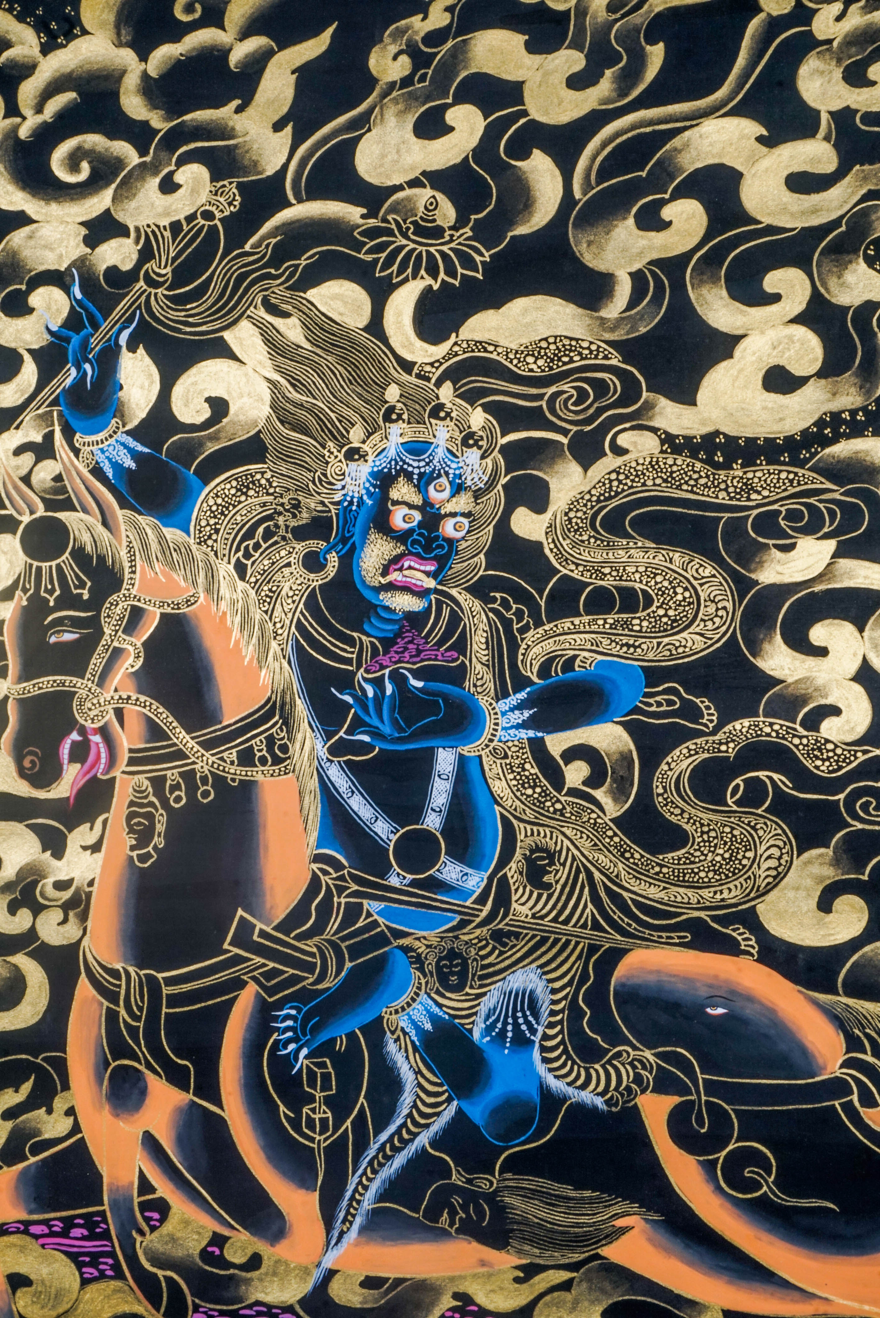 Palden Lhamo is a fierce protector deity in Tibetan Buddhism, symbolizing strength and the safeguarding of the Dharma. This vibrant Thangka, crafted with traditional techniques and gold leaf, captures her powerful energy and serves as a potent focus for meditation and spiritual protection in any sacred space.