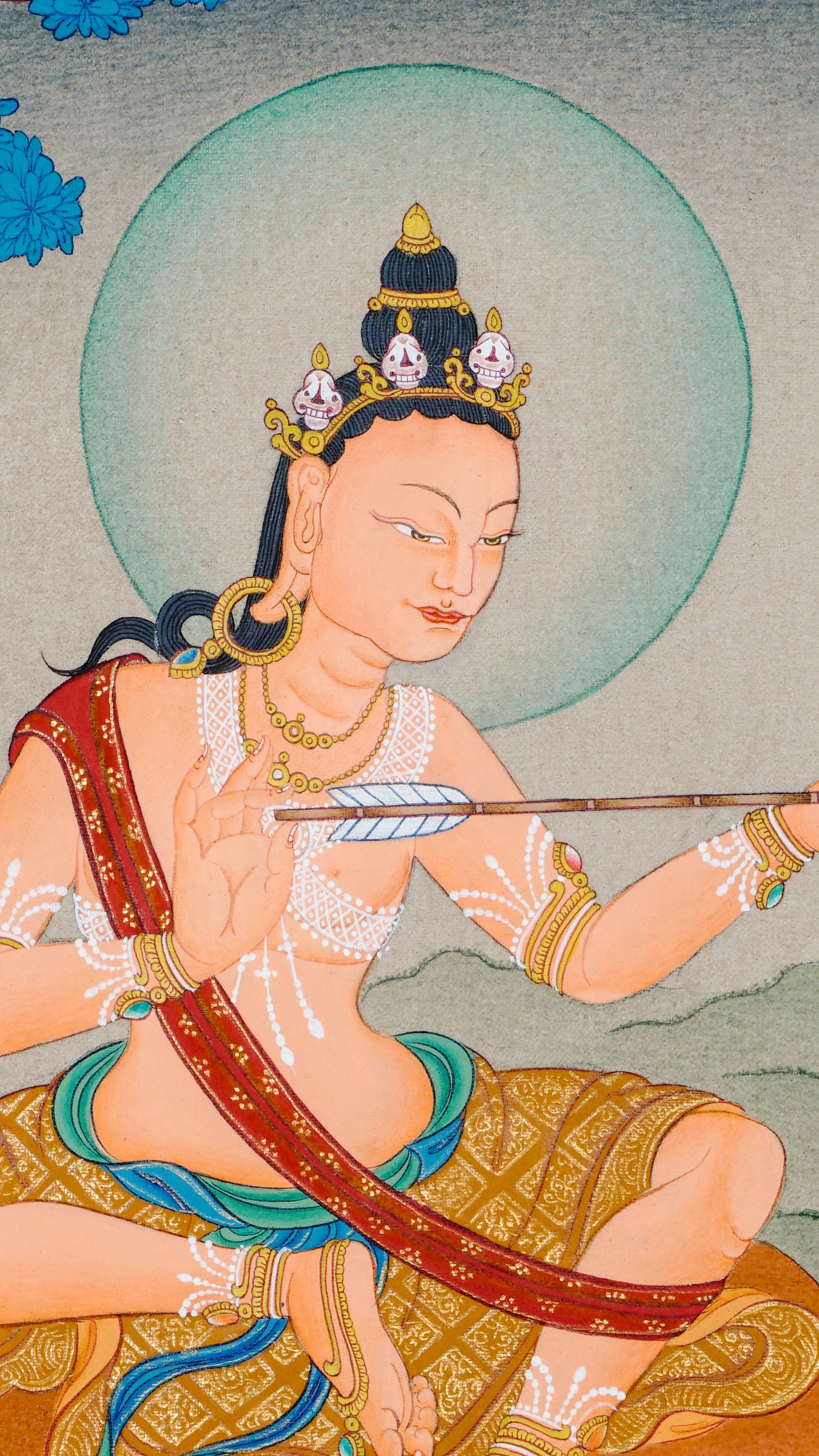 Hand painted thangka of Mahasiddha Saraha seated on a deer skin mat, holding an arrow symbolizing insight, with a quiver beside him and a serene blue tree and landscape in the background.
