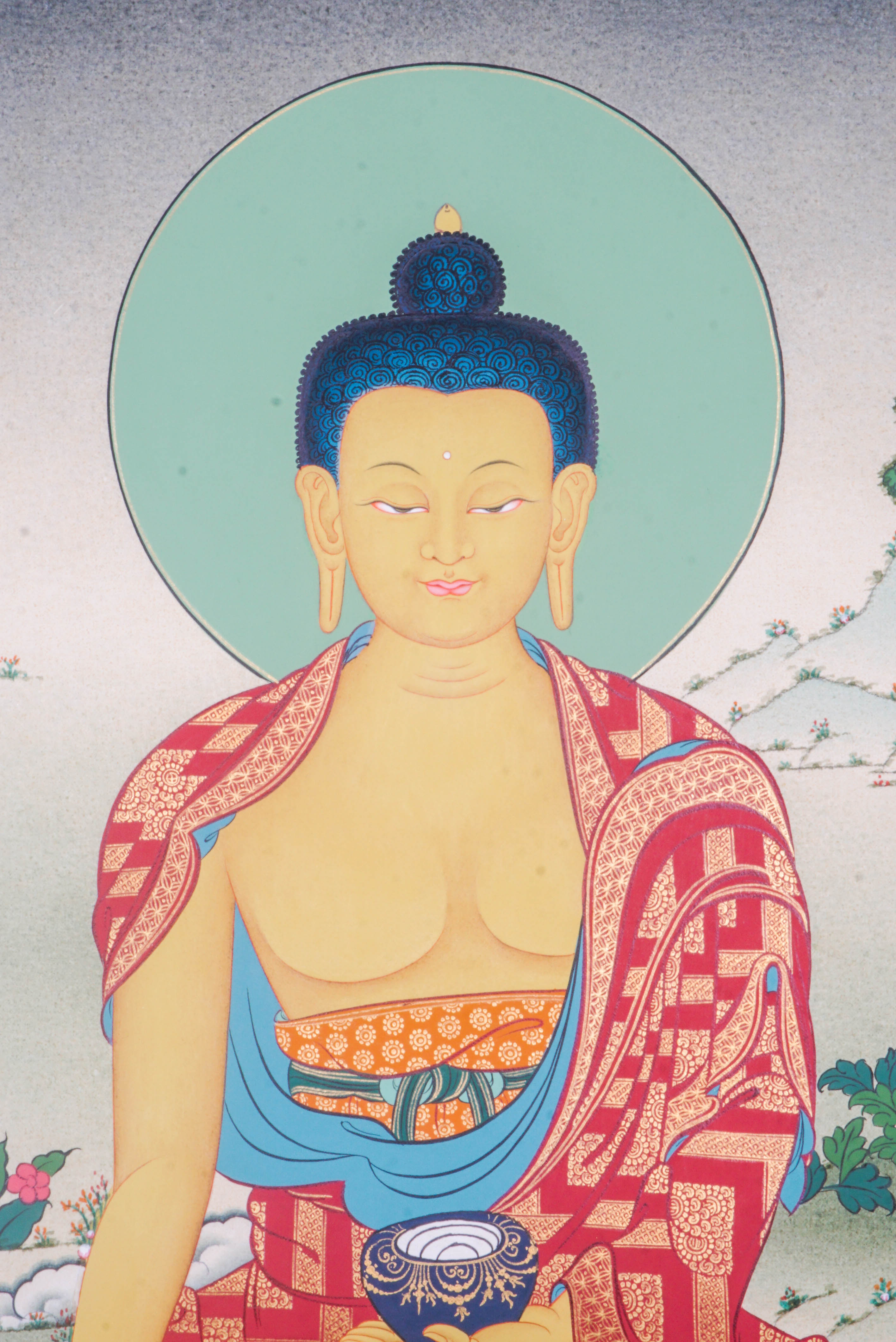 The Shakyamuni Buddha Thangka Painting depicts the Buddha of enlightenment in serene meditation, radiating peace, compassion, and spiritual wisdom. Hand-painted by skilled Tibetan artists with natural pigments, this exquisite artwork enhances any space with its vibrant detail and deep spiritual significance.