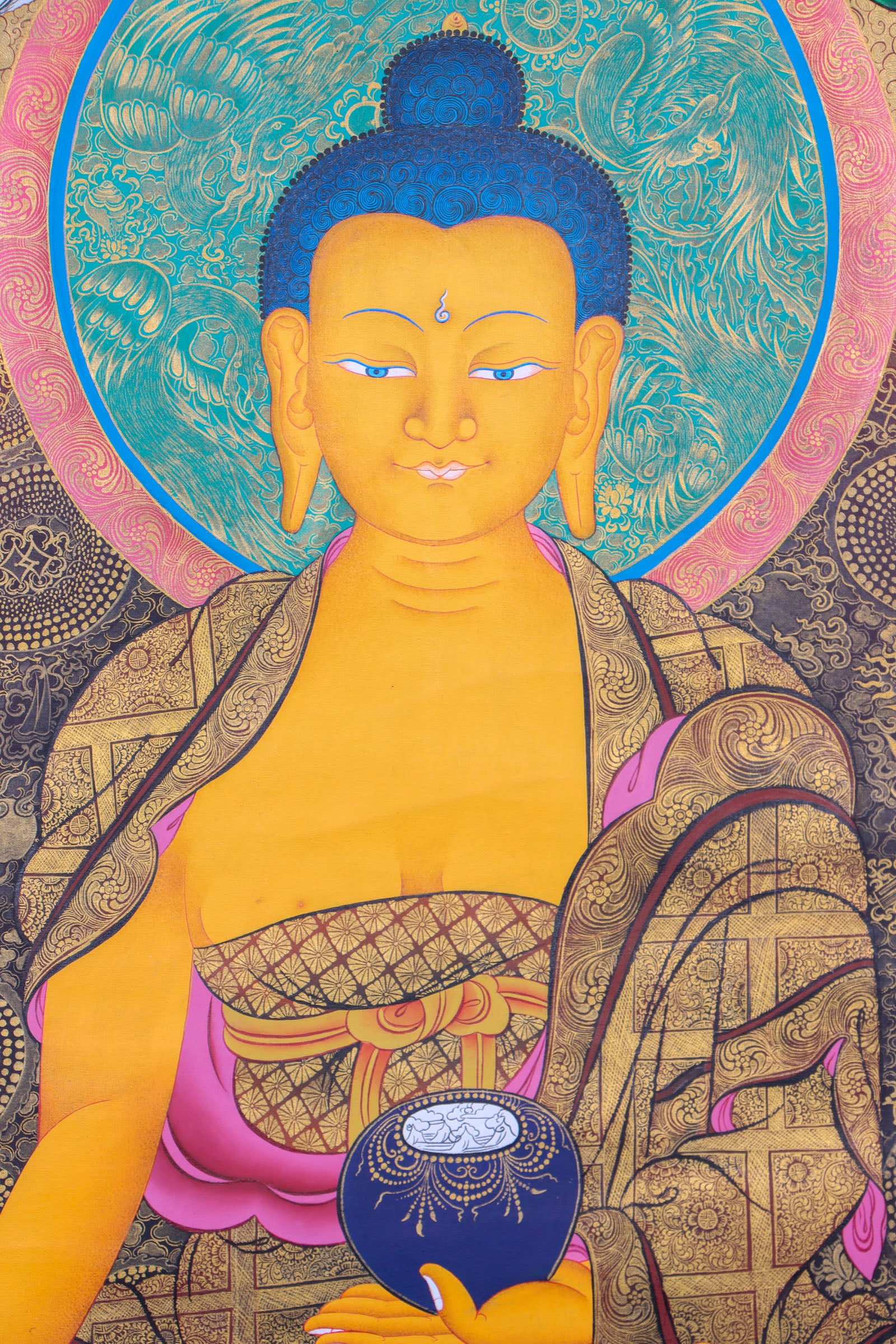 This exquisite Shakyamuni Buddha Thangka, hand-painted on cotton canvas using natural mineral pigments, radiates the peaceful essence of the Enlightened One and reflects the deep spiritual artistry of Tibetan culture.