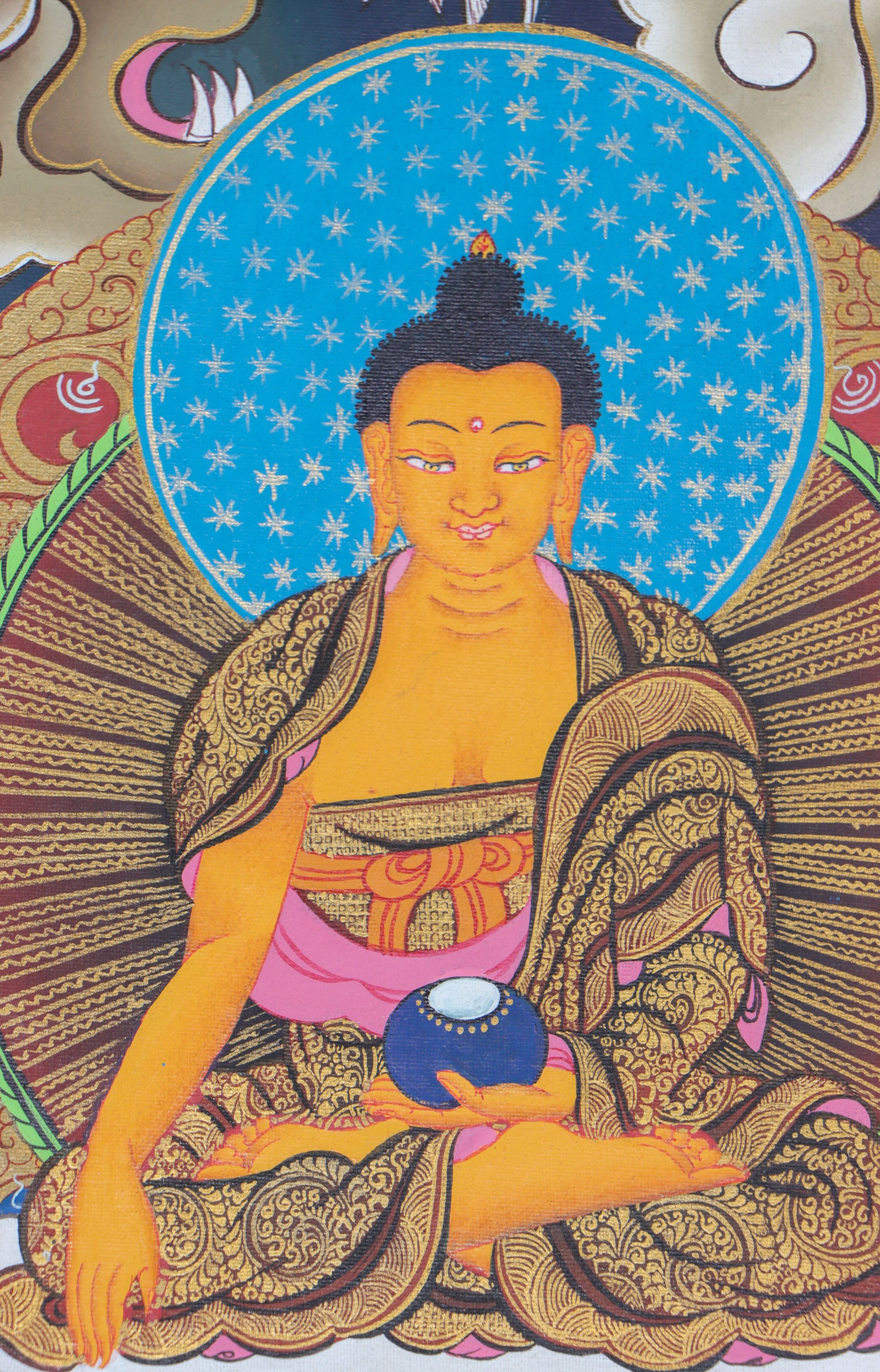 This exquisite Shakyamuni Buddha Thangka, hand-painted on cotton canvas using natural mineral pigments, radiates the peaceful essence of the Enlightened One and reflects the deep spiritual artistry of Tibetan culture.
