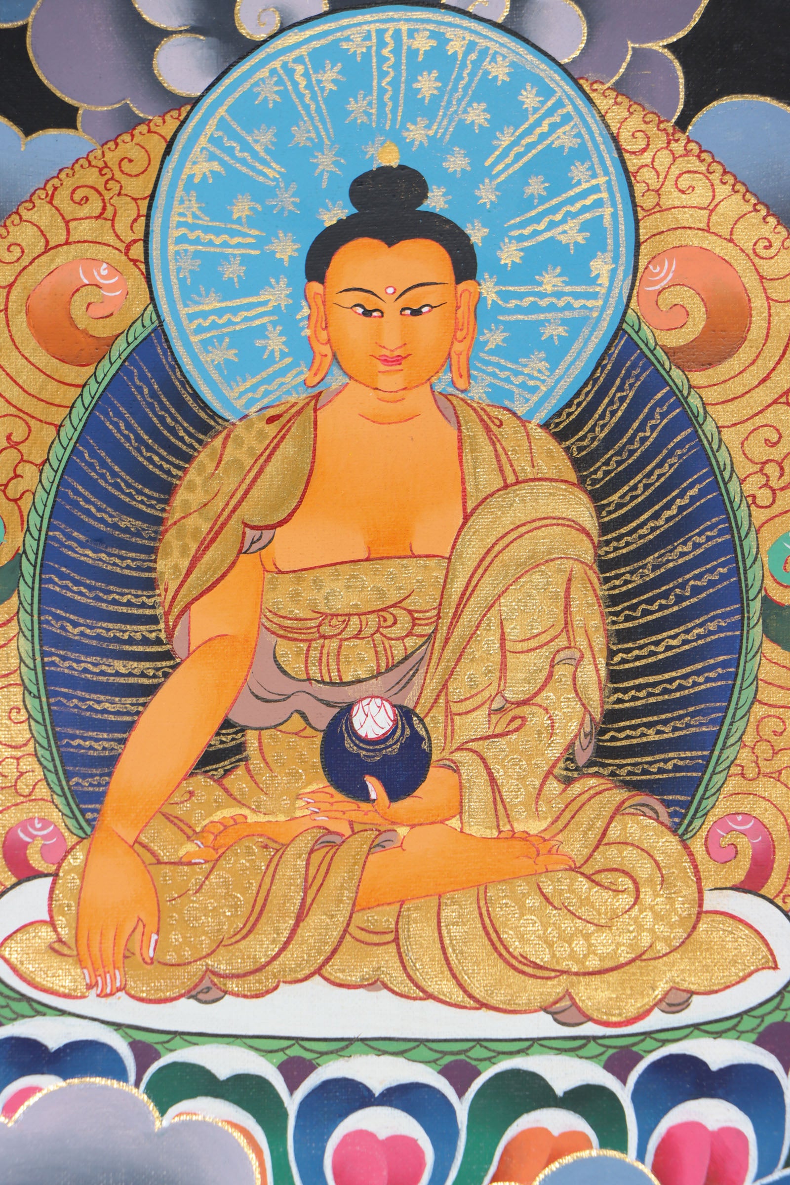 This genuine Tibetan thangka of Shakyamuni Buddha, hand-painted on durable cotton canvas with natural mineral pigments, beautifully captures his serene enlightened presence and profound teachings. Perfect for meditation spaces or sacred areas, this authentic Buddhist artwork radiates spiritual calm and showcases exceptional Tibetan craftsmanship.