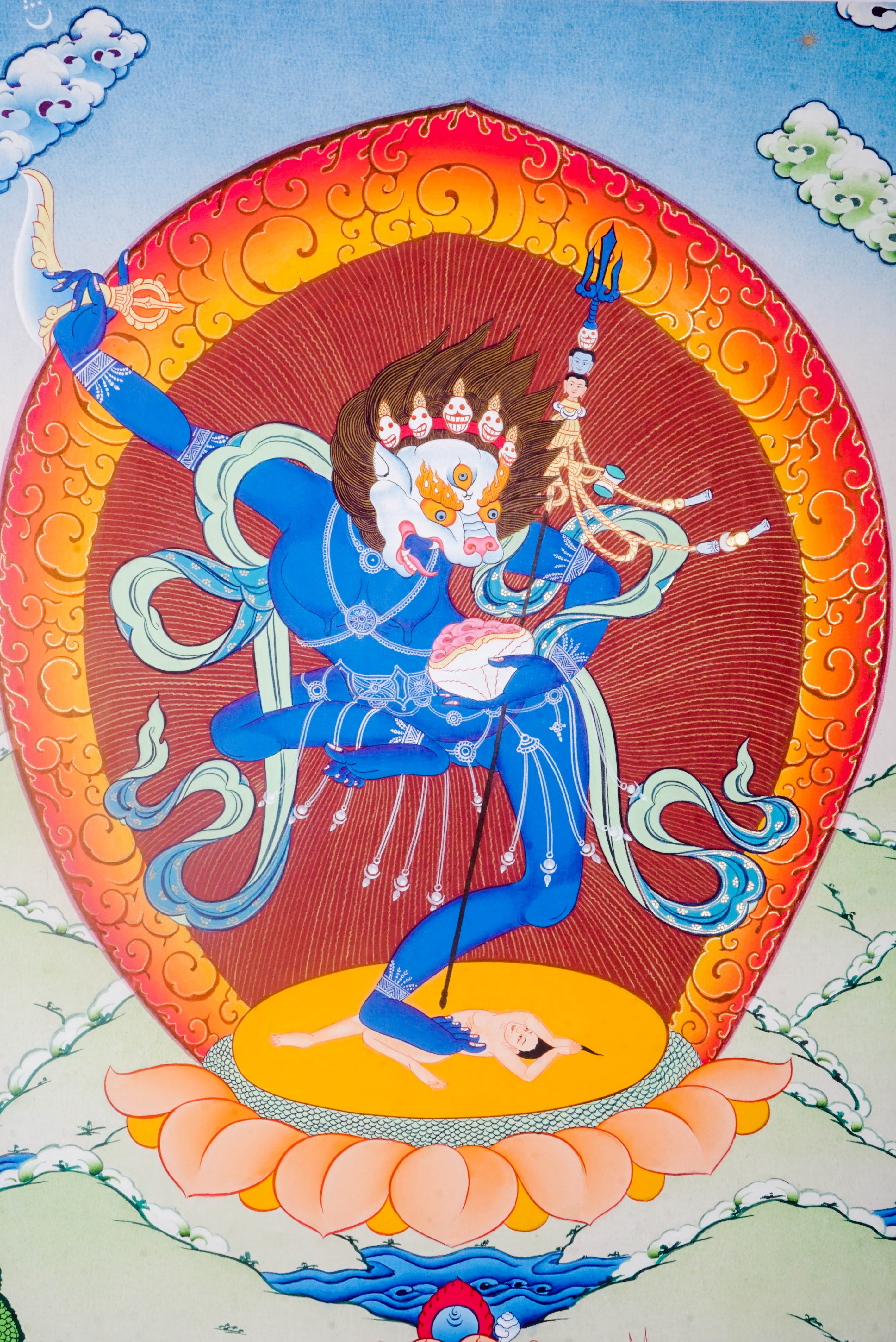 The Simhamukha Thangka shows the fierce Lion-Faced Dakini, a Tibetan Buddhist protector who removes negativity and ignorance. Hand-painted with natural pigments, it brings strength, clarity, and divine protection to any sacred space.