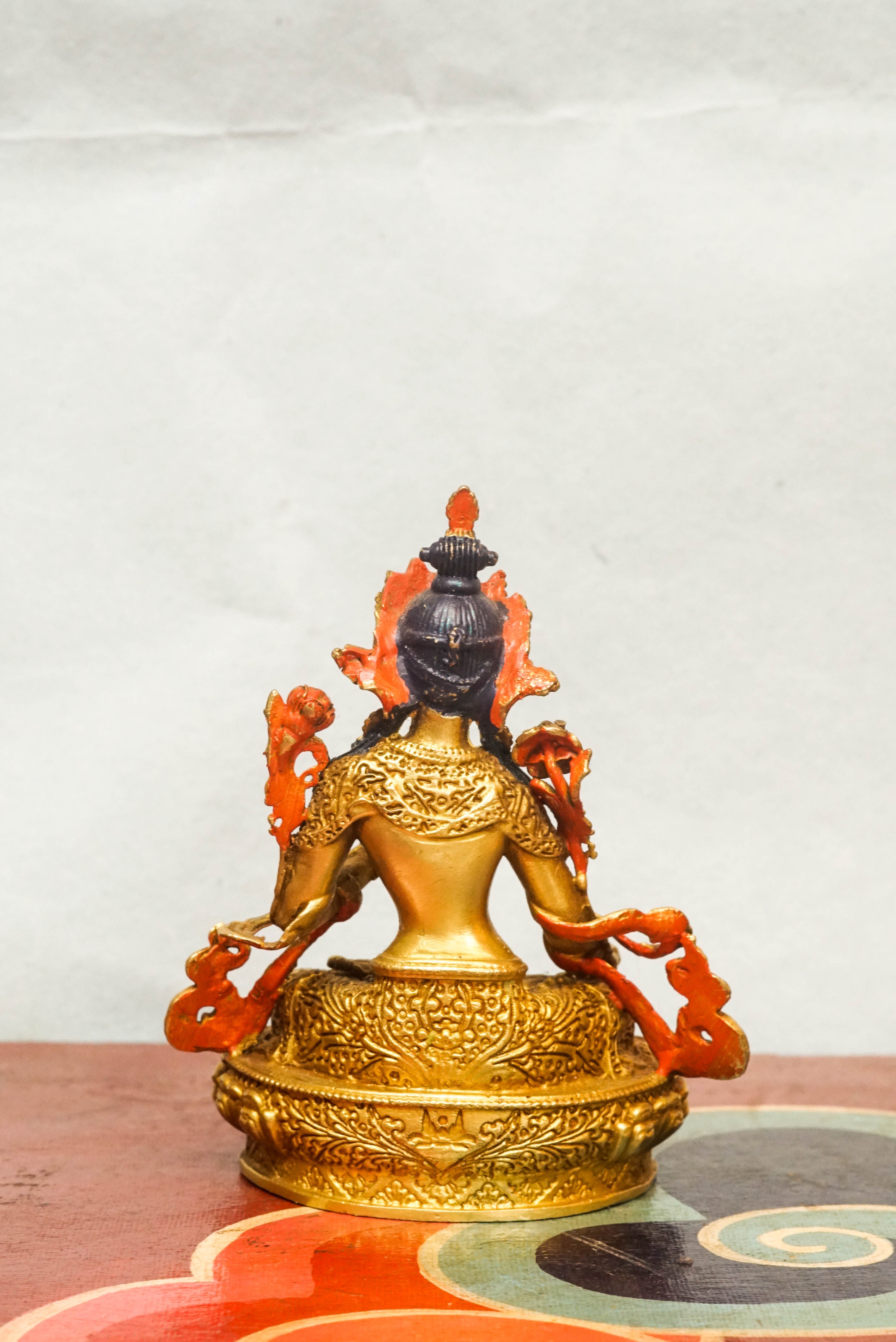 Gold-plated White Tara statue, depicting the compassionate goddess with calm expression and symbolic seven eyes.