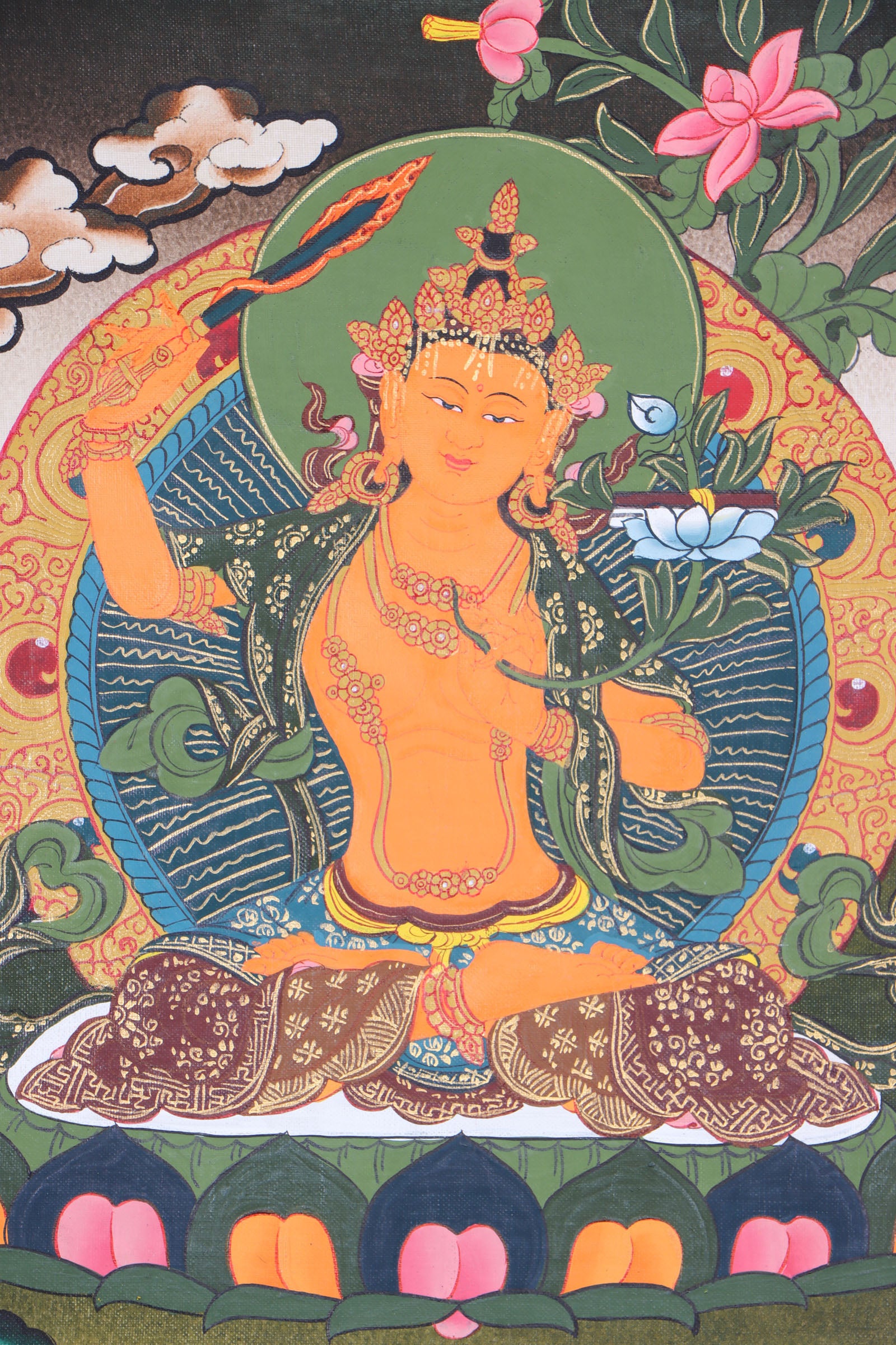 This Tibetan Thangka of Manjushri is a genuine Buddhist artwork that symbolizes wisdom and enlightenment. Hand-painted with natural pigments, it beautifully depicts Manjushri with his sacred sword and text, offering a powerful reminder of clarity and inner knowledge.
