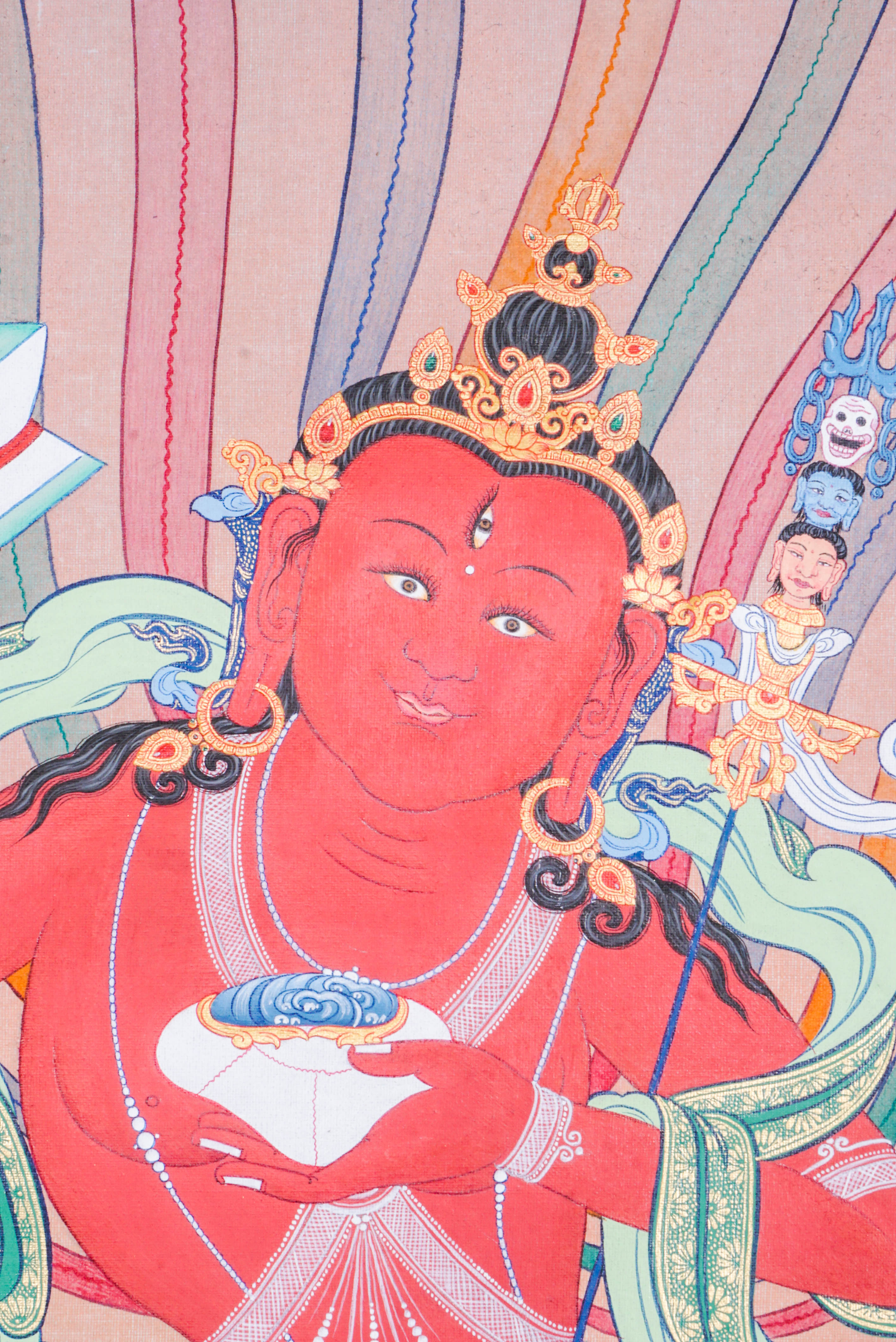 Hand-painted Guru Padmasambhava thangka artwork featuring traditional Tibetan Buddhist iconography, red deity figure, lotus seat, and detailed ceremonial elements.