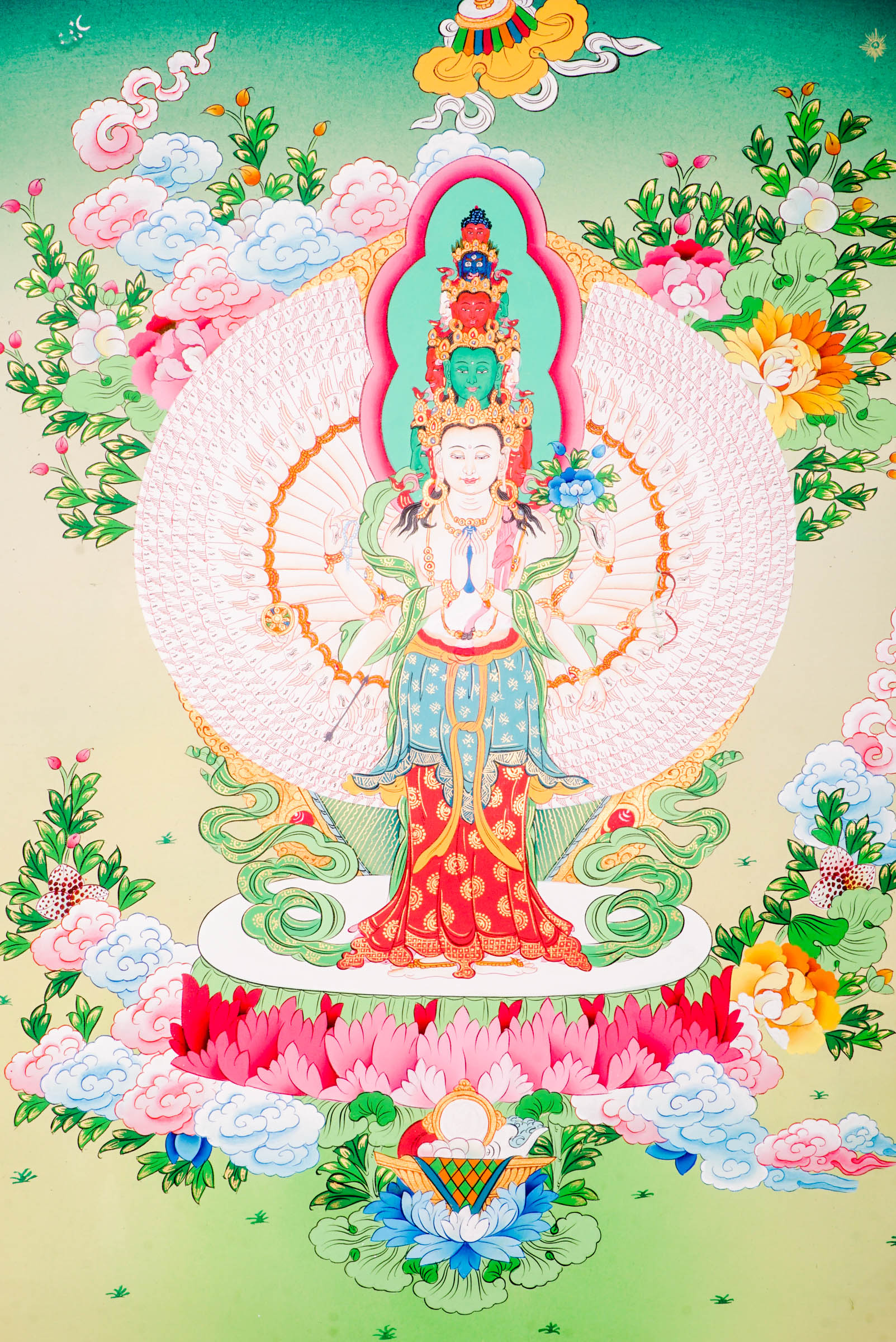 A sacred hand-painted thangka art showcasing Avalokeshwor surrounded by a stunning circle of a thousand arms.