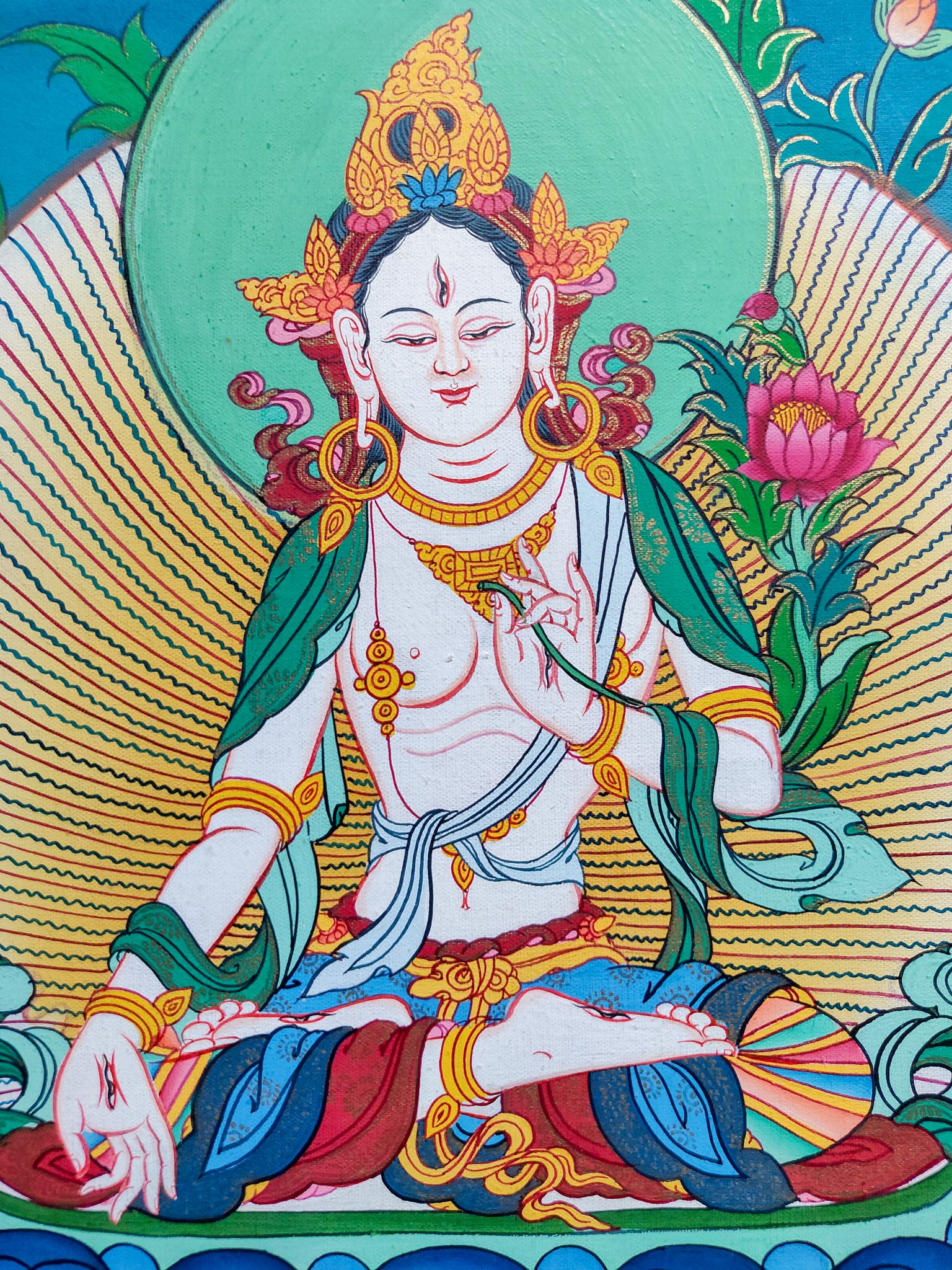 This White Tara Thangka Painting is perfect for bringing peace and enlightenment into your home or other holy location.