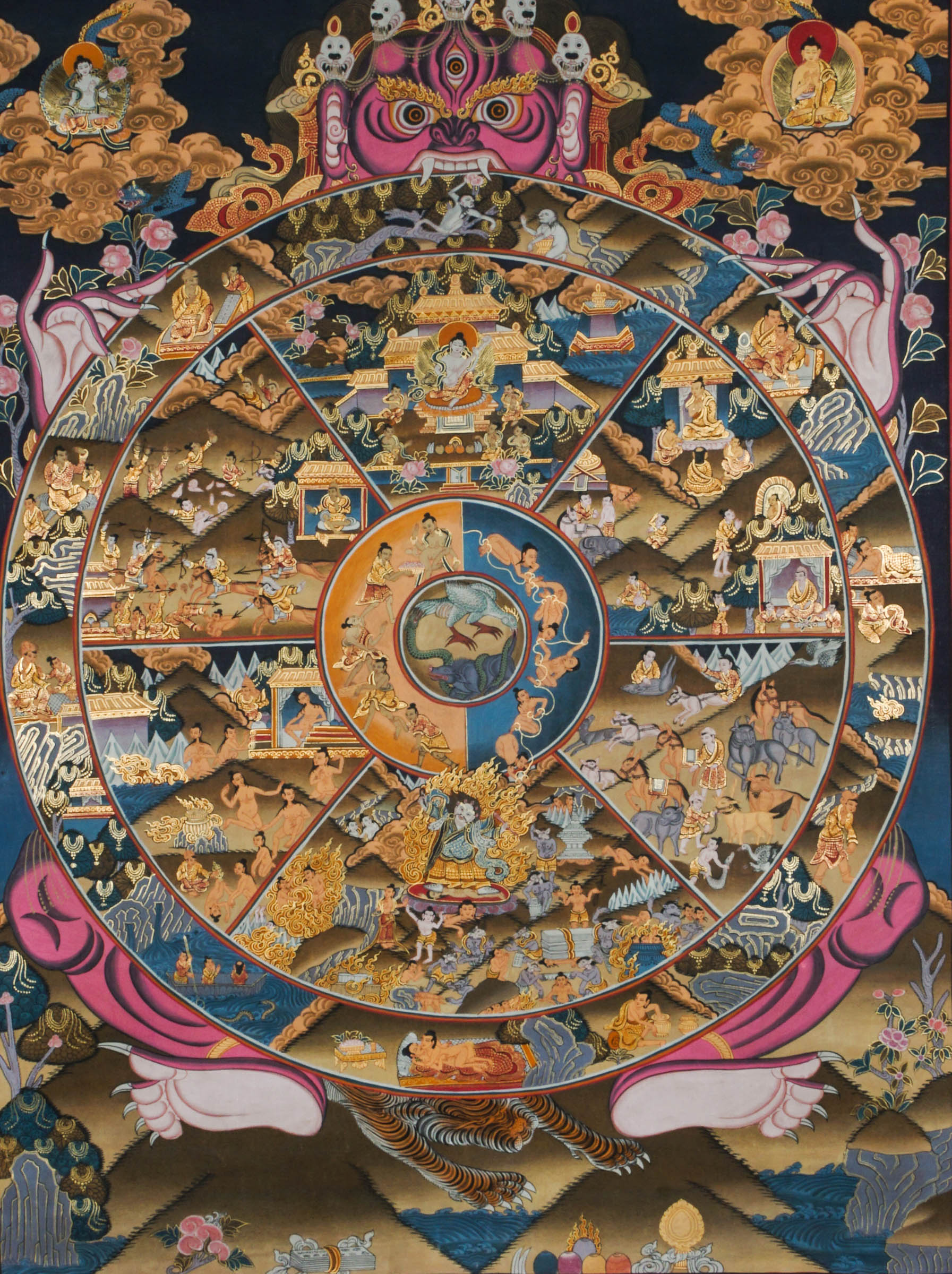 This Tibetan Wheel of Life Thangka, also known as Bhavachakra, illustrates the cycle of samsara and the path to enlightenment through vivid, symbolic detail. Hand-painted with natural mineral pigments, it serves as a powerful Buddhist teaching tool and a striking spiritual centerpiece.
