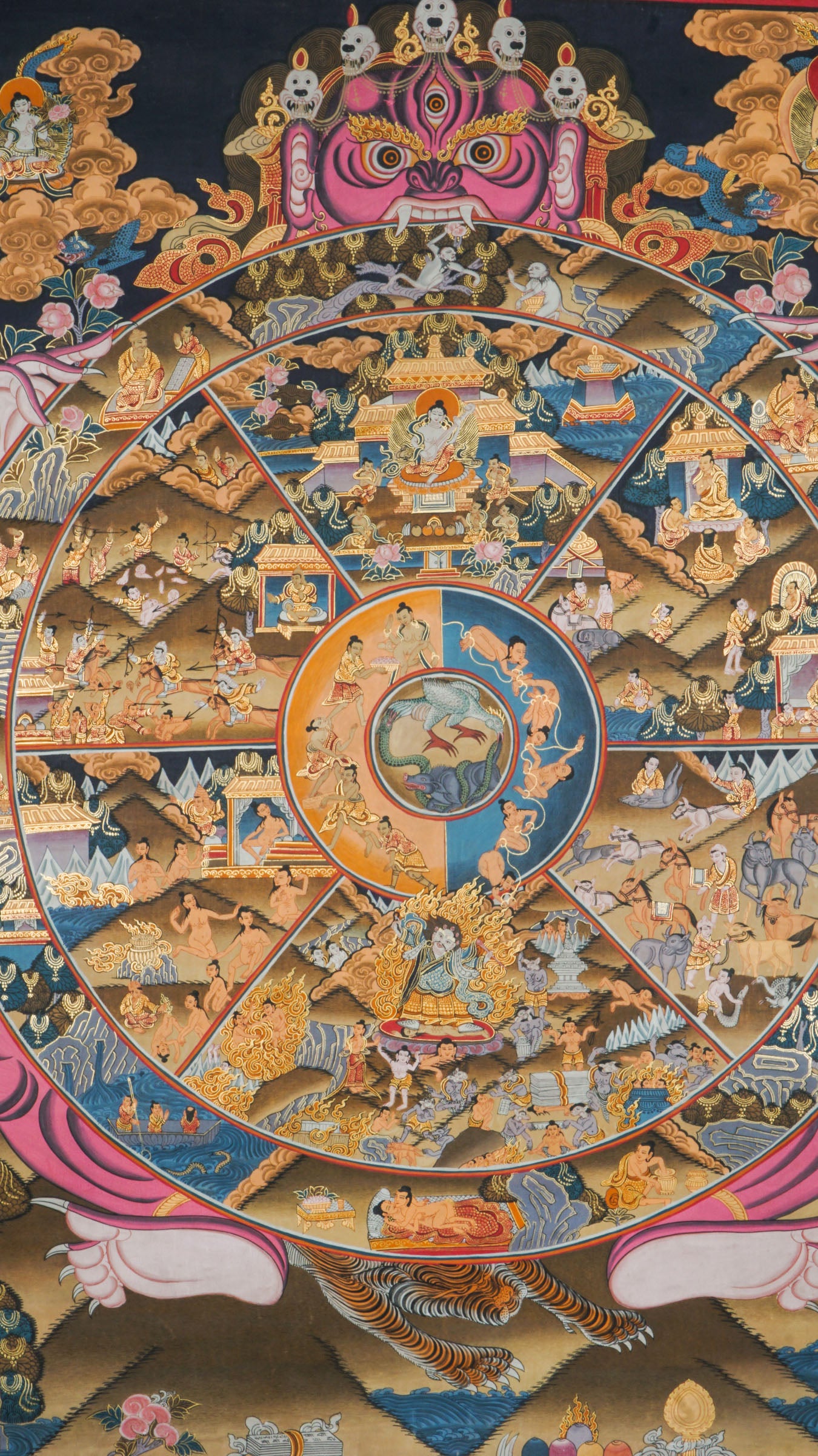 This Tibetan Wheel of Life Thangka, also known as Bhavachakra, illustrates the cycle of samsara and the path to enlightenment through vivid, symbolic detail. Hand-painted with natural mineral pigments, it serves as a powerful Buddhist teaching tool and a striking spiritual centerpiece.