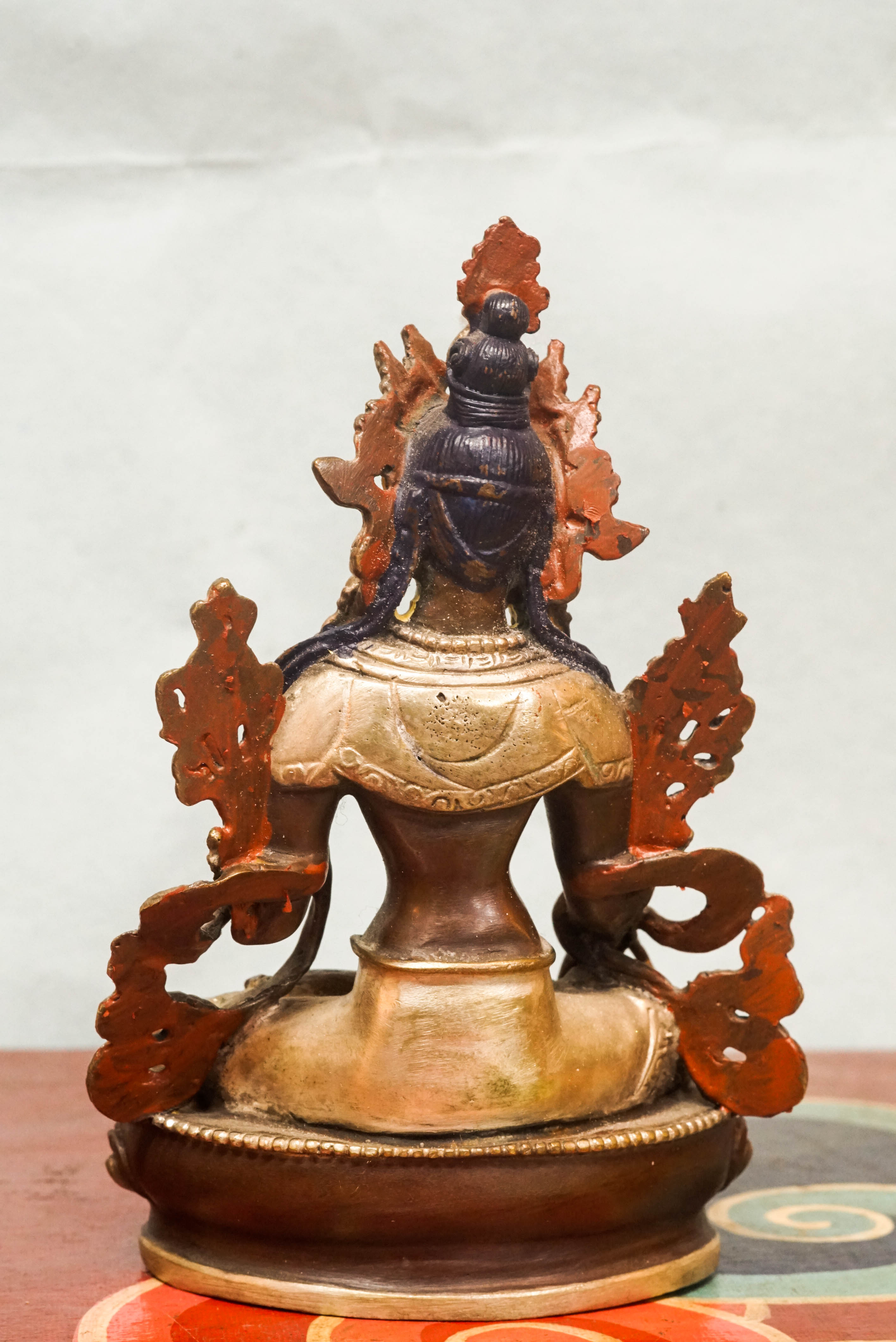 Detailed statue of White Tara, Tibetan Buddhist Bodhisattva of compassion and longevity, featuring seven eyes and traditional robes.