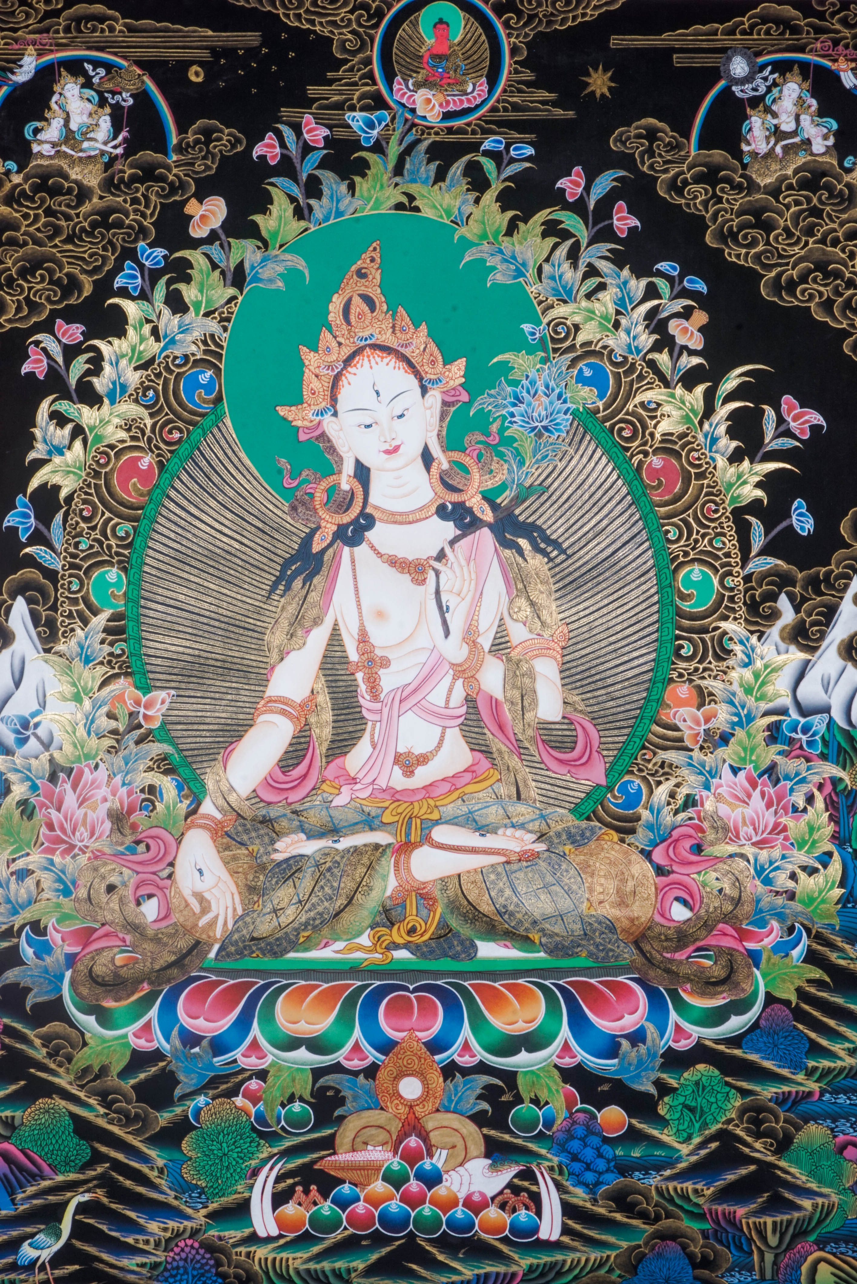 The White Tara Thangka Painting symbolizes healing, compassion, and long life, featuring the goddess with seven eyes and hand-painted using natural pigments by Tibetan artisans—perfect for spiritual growth and protection.