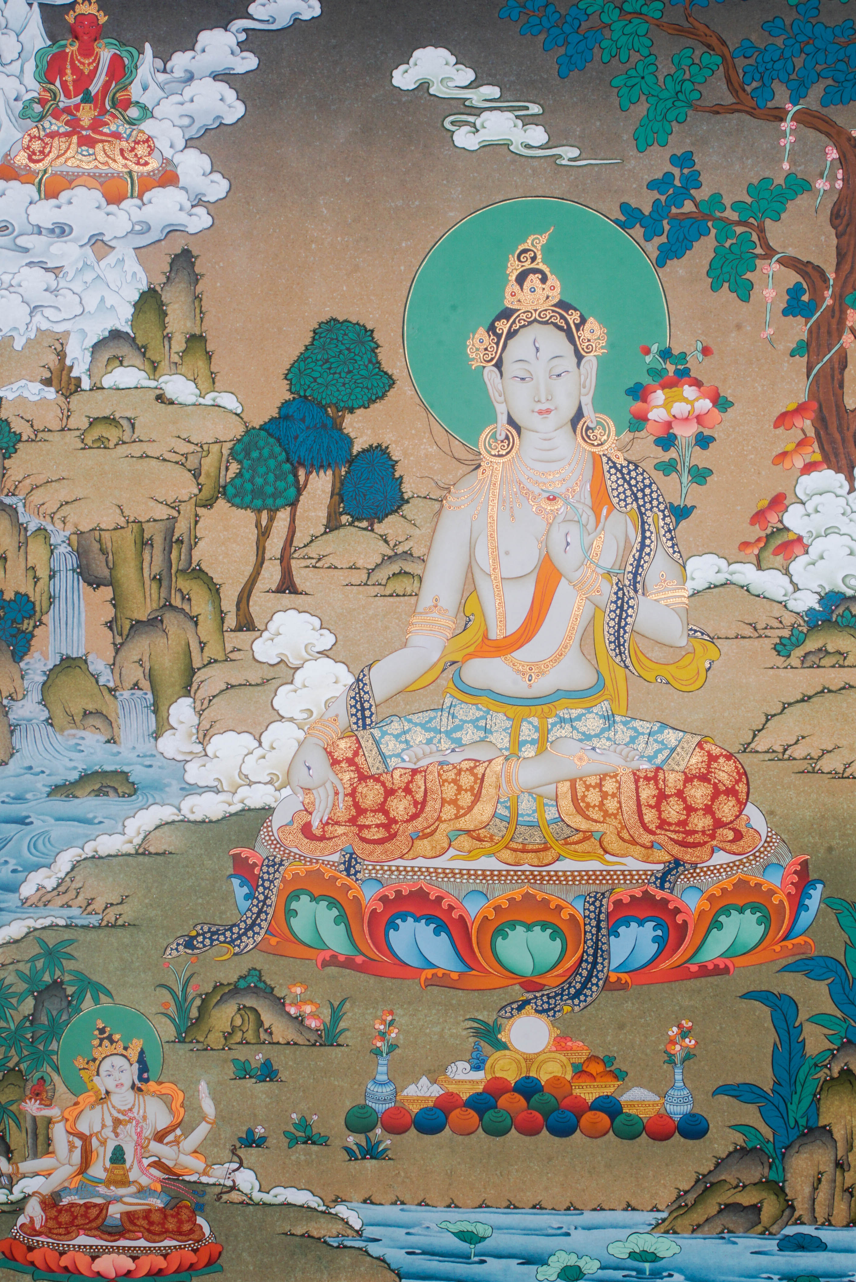Hand-painted White Tara thangka artwork featuring traditional Tibetan Buddhist iconography, lotus base, scenic landscape, and intricate detailing.
