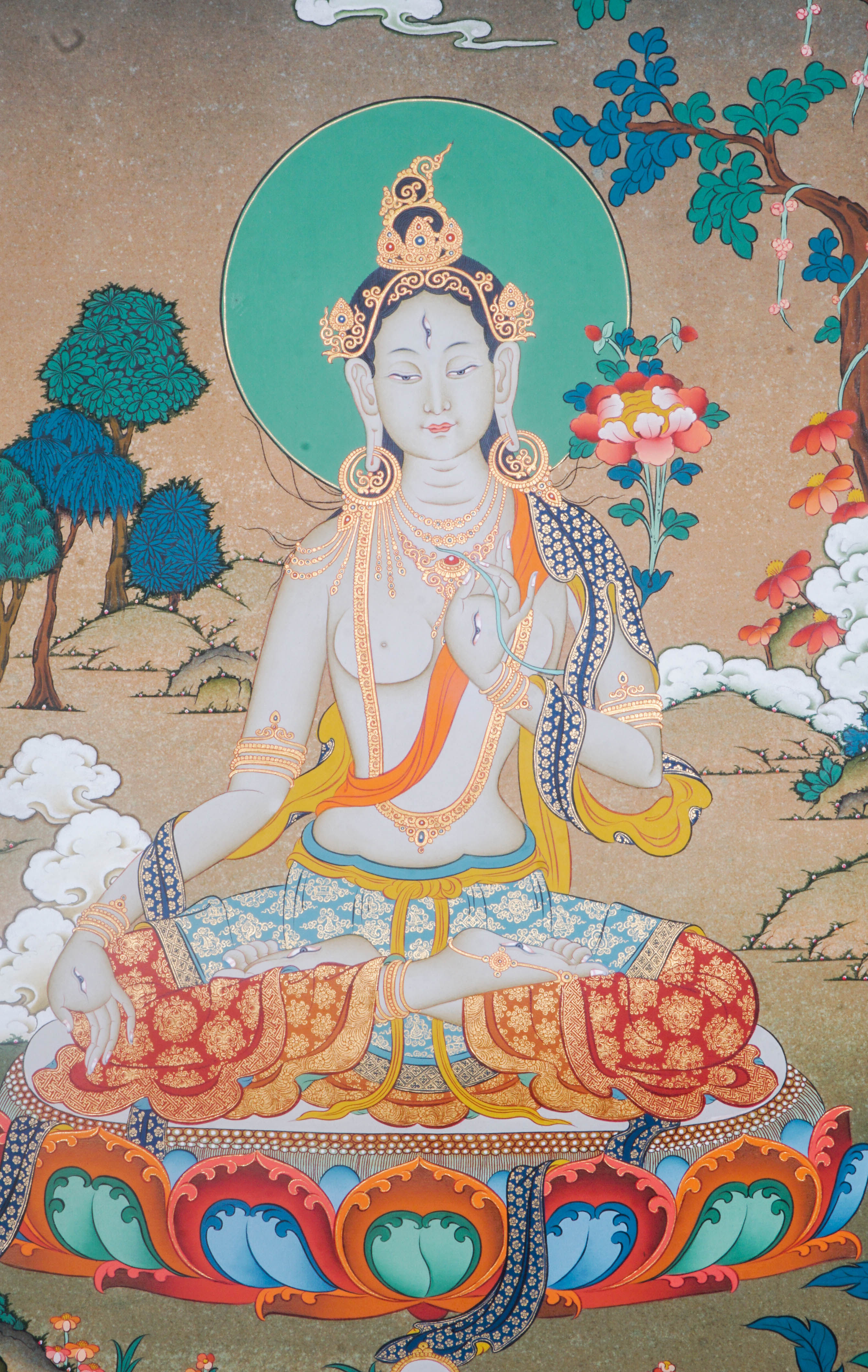 Hand-painted White Tara thangka artwork featuring traditional Tibetan Buddhist iconography, lotus base, scenic landscape, and intricate detailing.