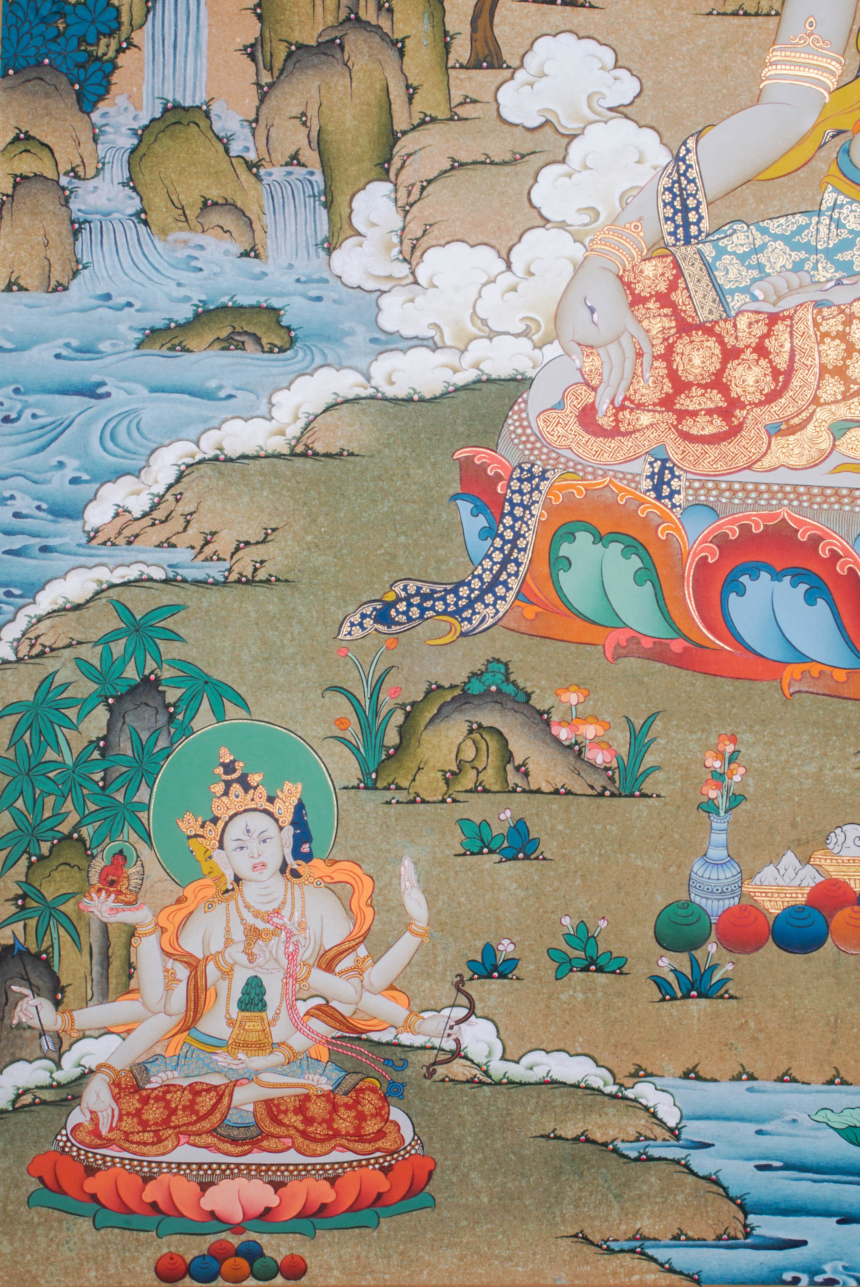 Hand-painted White Tara thangka artwork featuring traditional Tibetan Buddhist iconography, lotus base, scenic landscape, and intricate detailing.