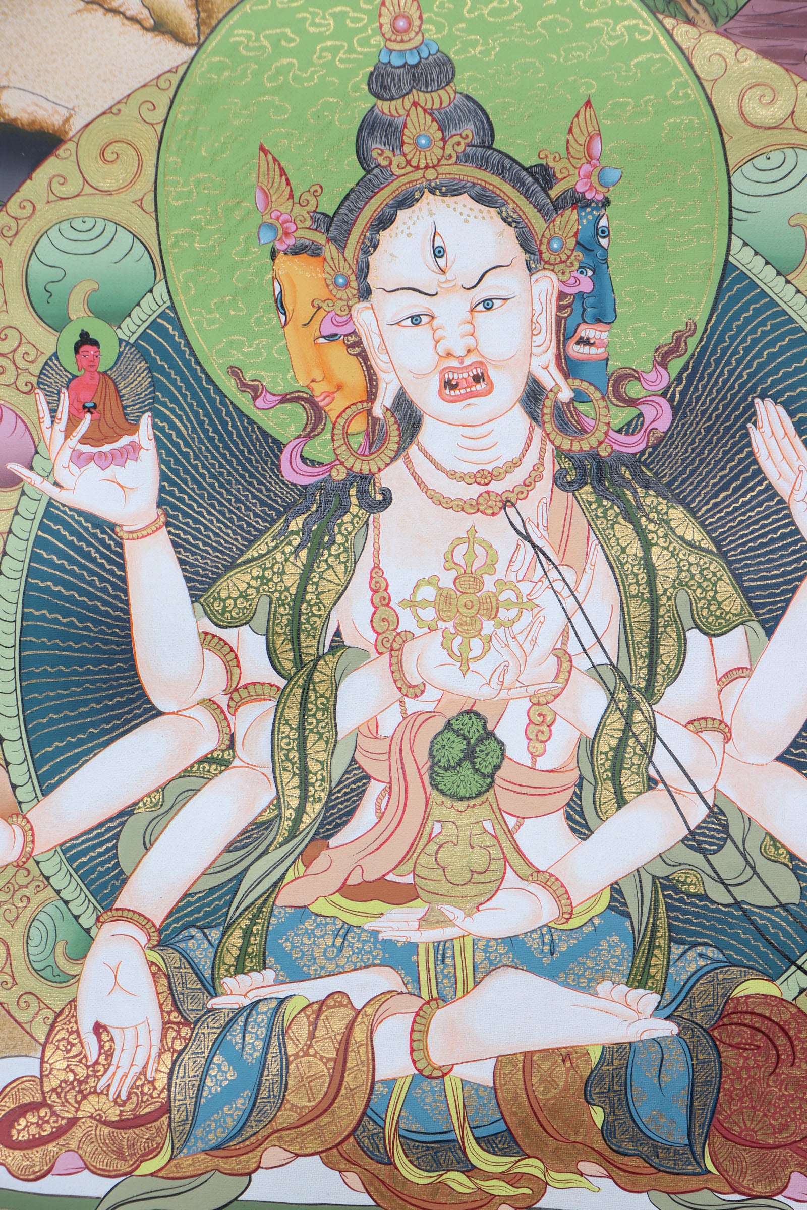 This genuine White Tara Thangka is a captivating piece of Tibetan art symbolizing compassion, purity, and healing. Hand-painted by skilled artisans using all-natural mineral pigments, it features White Tara seated in serene grace with seven vigilant eyes, offering blessings of peace, longevity, and spiritual protection.