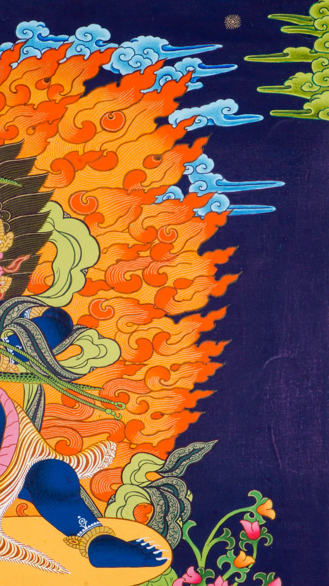 Traditional Tibetan thangka painting depicting wrathful Vajrapani, a blue-skinned deity in a powerful dynamic pose on a lotus throne, surrounded by blazing flames, clouds, and ornate symbolic details against a deep blue background.