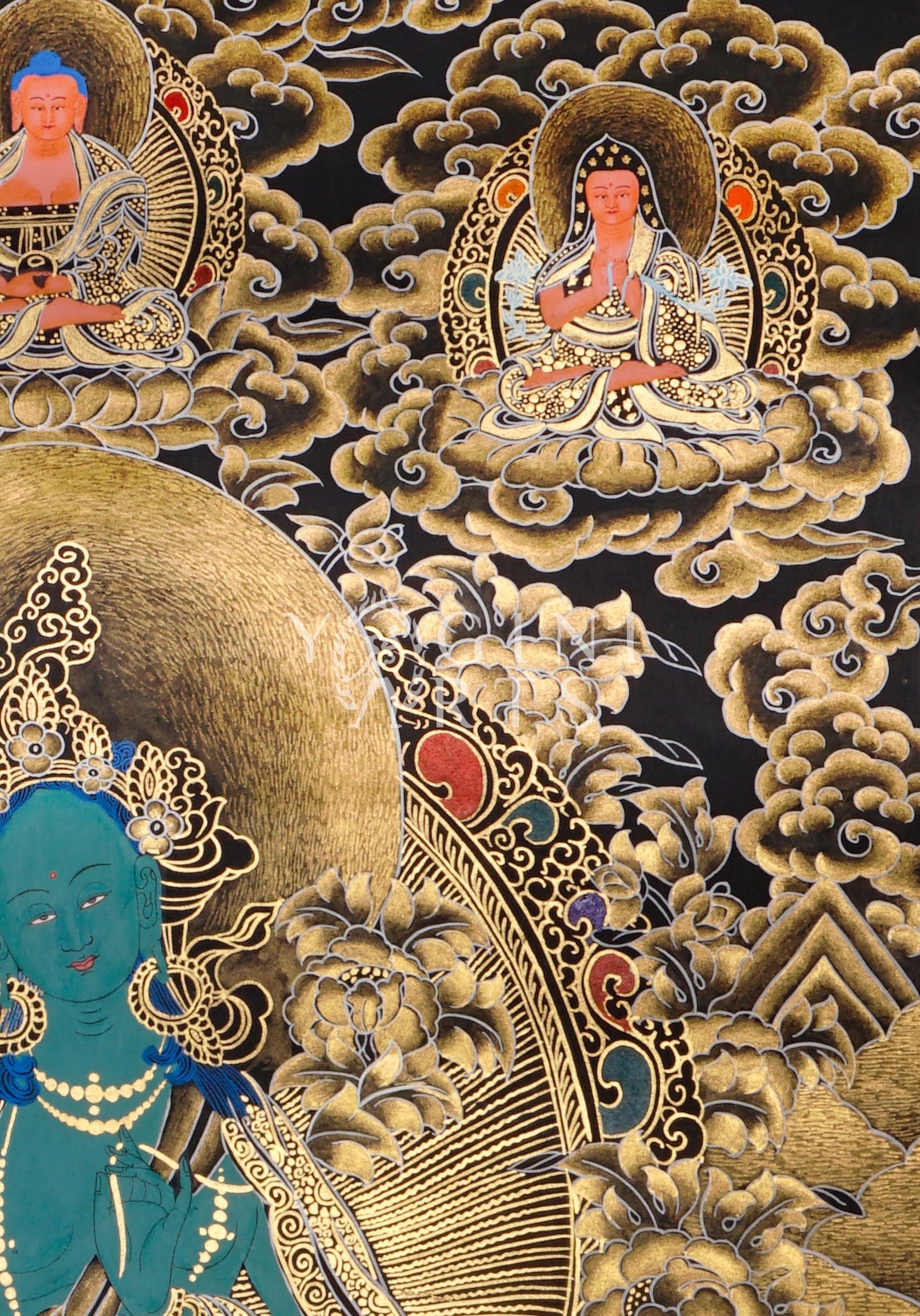 Black and Gold Green Tara thangka featuring the  Buddhist goddess seated on a lotus throne surrounded by golden floral motifs and celestial figures