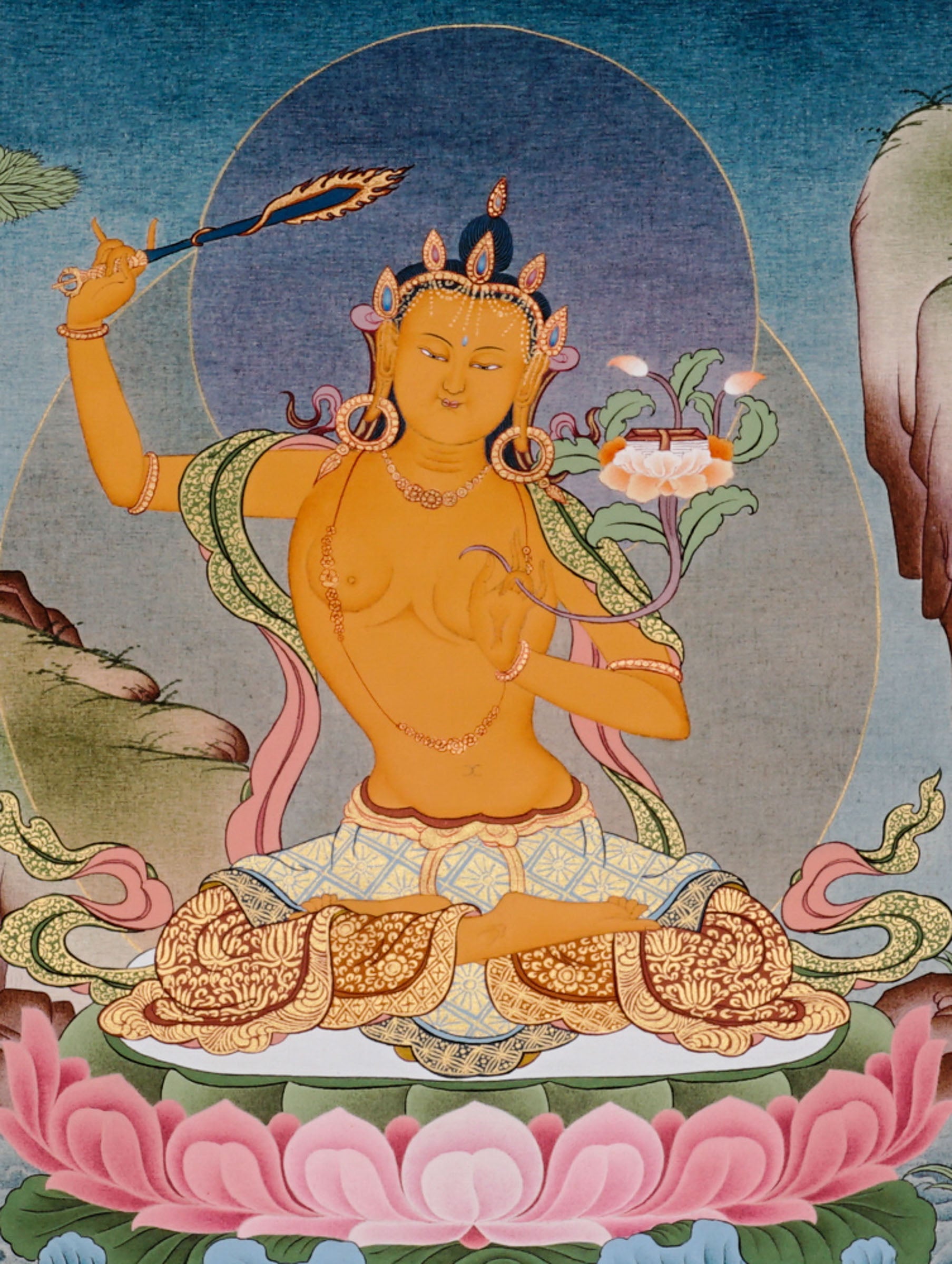 Manjushree Bodhisattva seated on a pink lotus above flowing water, holding flaming wisdom sword and sacred scripture lotus.