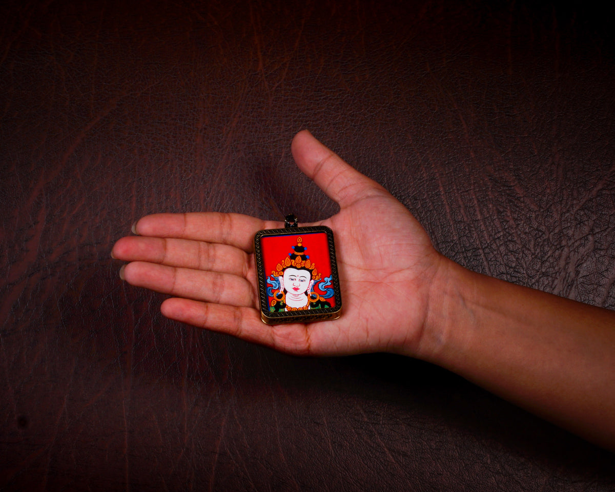 Vajrasattva Ghau pendant in an antique-style metal frame featuring a miniature Tibetan Buddhist painting handcrafted in Nepal.