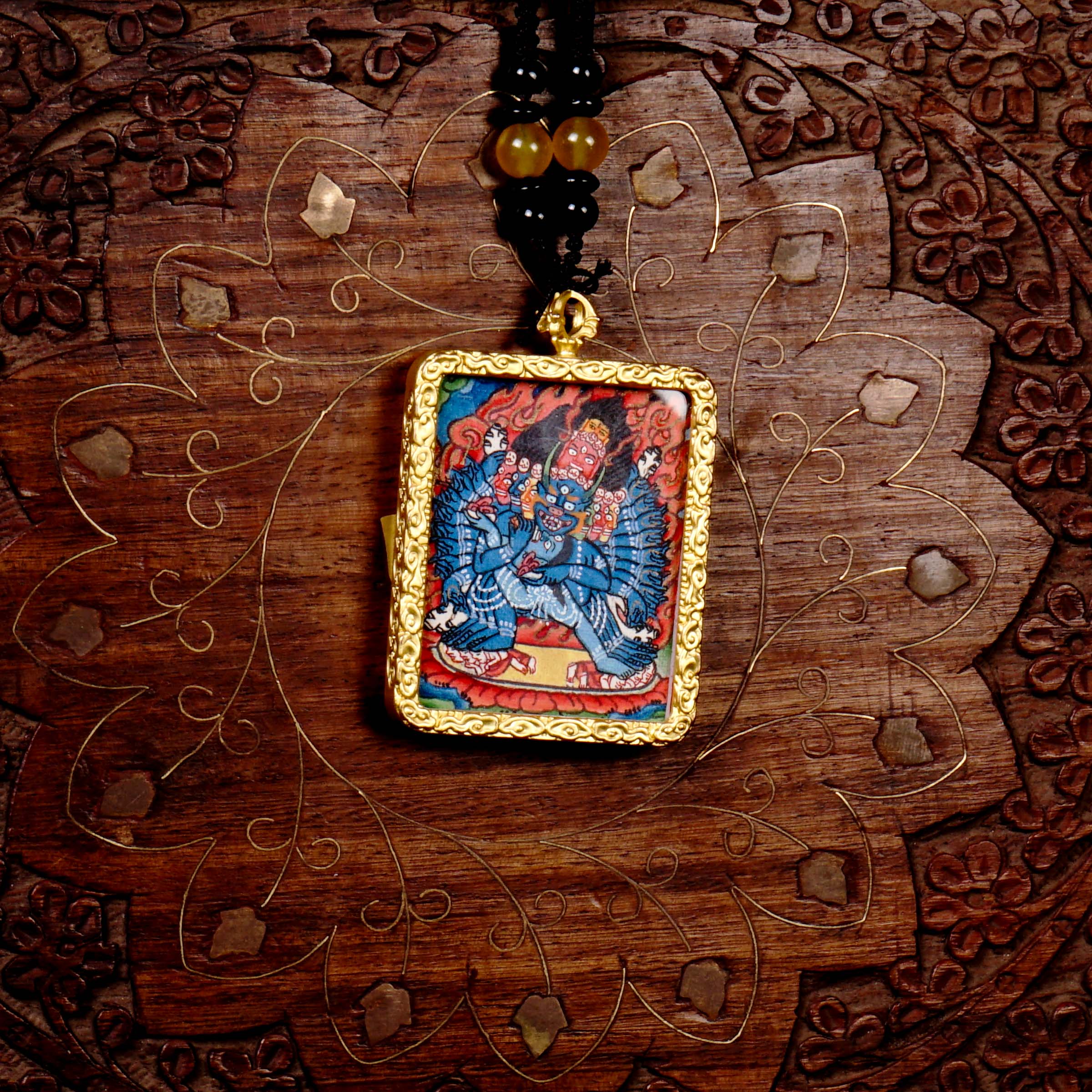 Hand-painted Yamantaka miniature Thangka pendant in gold-accented copper Ghau locket with black beaded cord.