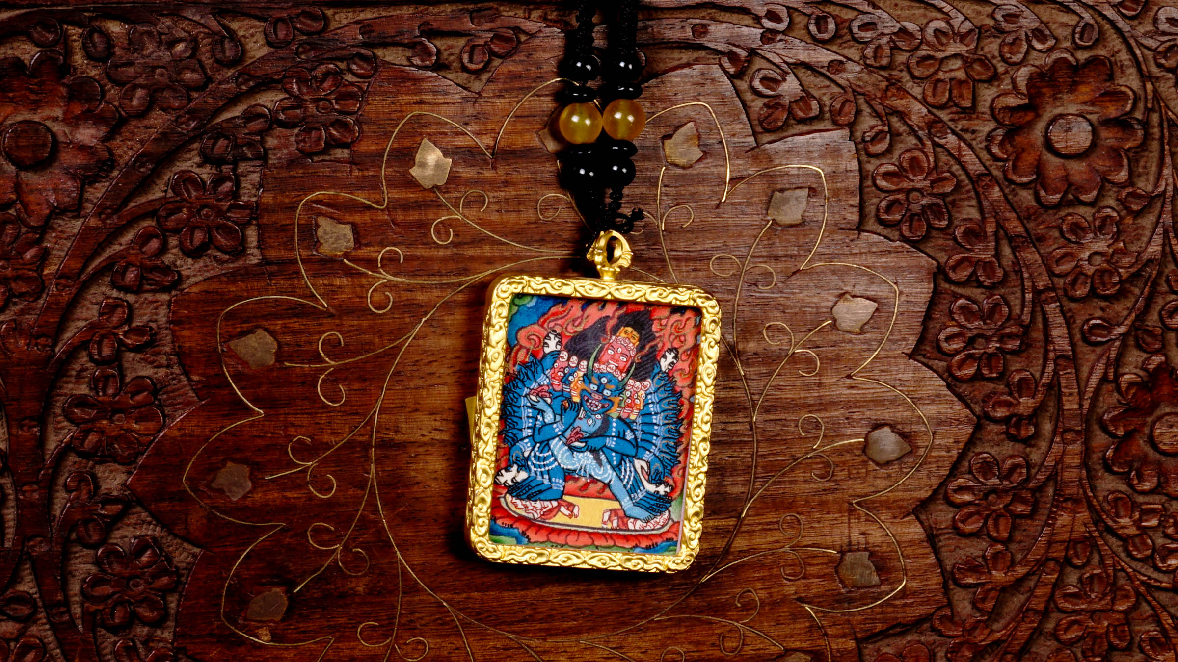 Hand-painted Yamantaka miniature Thangka pendant in gold-accented copper Ghau locket with black beaded cord.