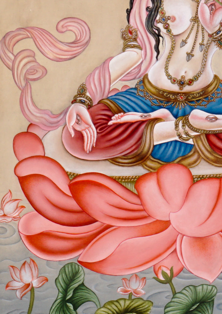 Hand-painted Newari White Tara thangka showing the Buddhist goddess of compassion seated on a lotus throne holding a utpala flower.