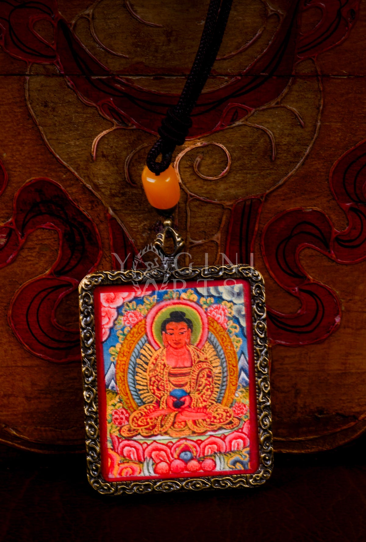 Hand-painted Amitabha Buddha Ghau pendant in an antique silver-tone frame, handcrafted in Nepal using traditional Himalayan miniature painting techniques.