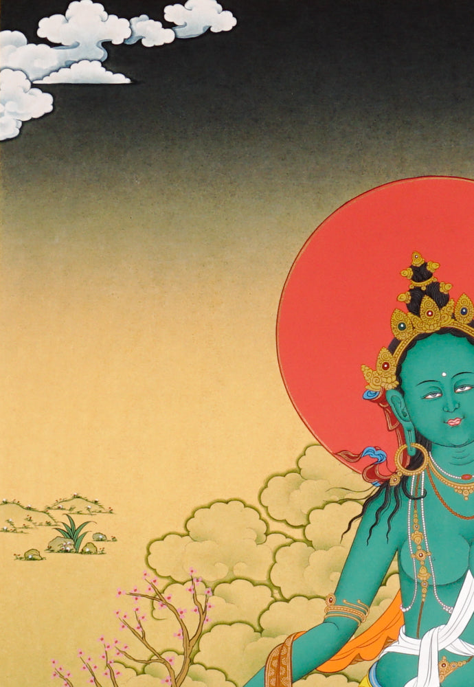 Hand-painted Green Tara thangka showing the Buddhist goddess seated on a lotus throne holding a blue utpala flower.