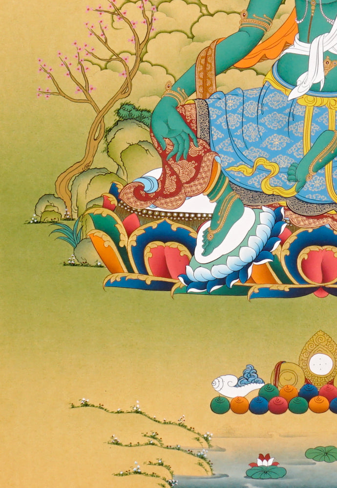 Hand-painted Green Tara thangka showing the Buddhist goddess seated on a lotus throne holding a blue utpala flower.