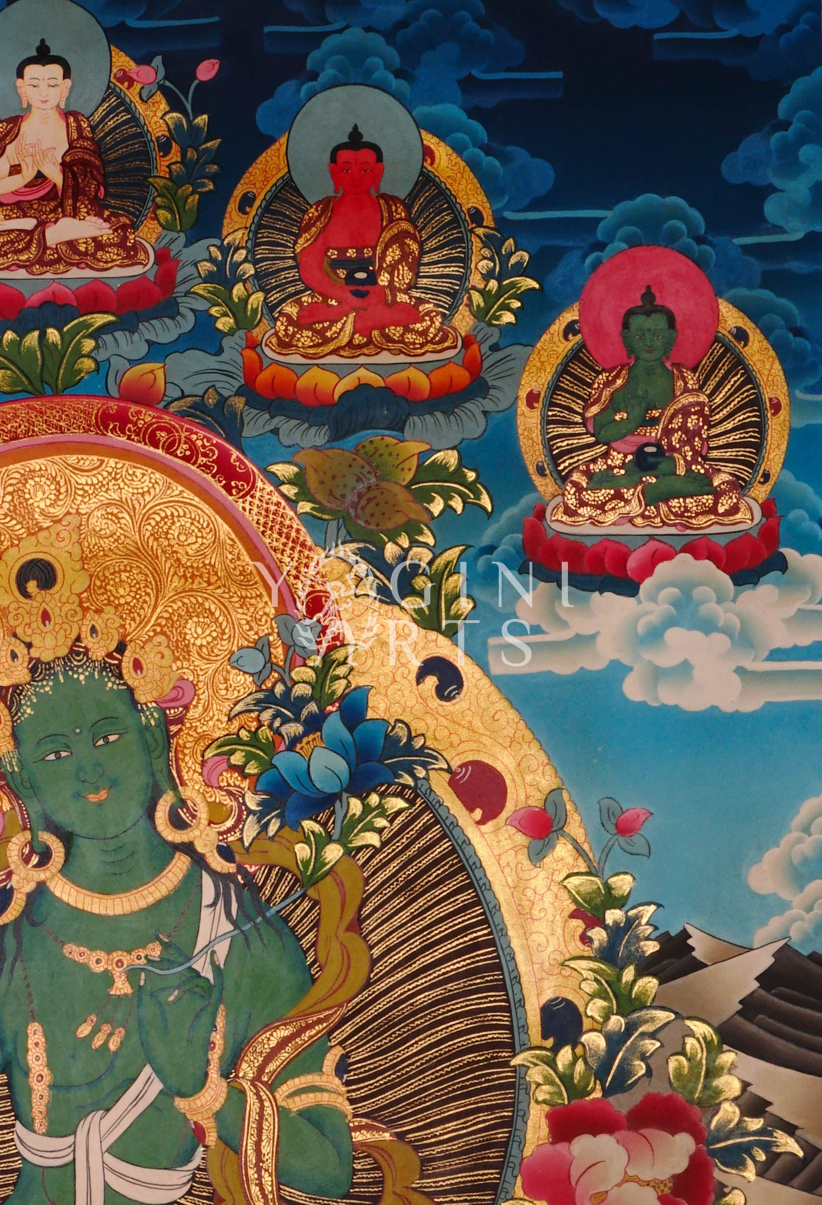 Green Tara thangka featuring the  Buddhist goddess of compassion seated on a lotus throne surrounded by vibrant sacred symbolism and gold detailing