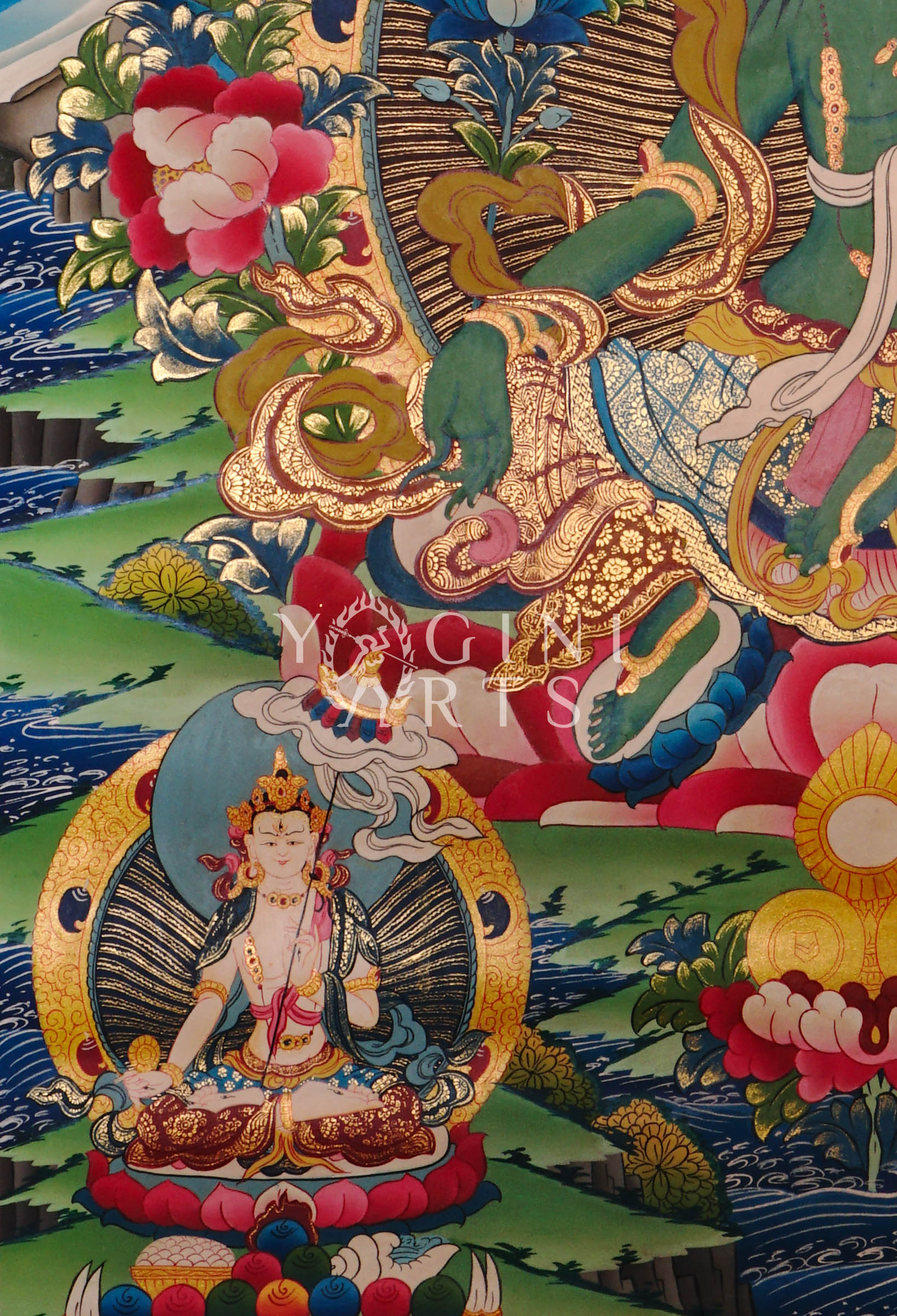 Green Tara thangka featuring the  Buddhist goddess of compassion seated on a lotus throne surrounded by vibrant sacred symbolism and gold detailing