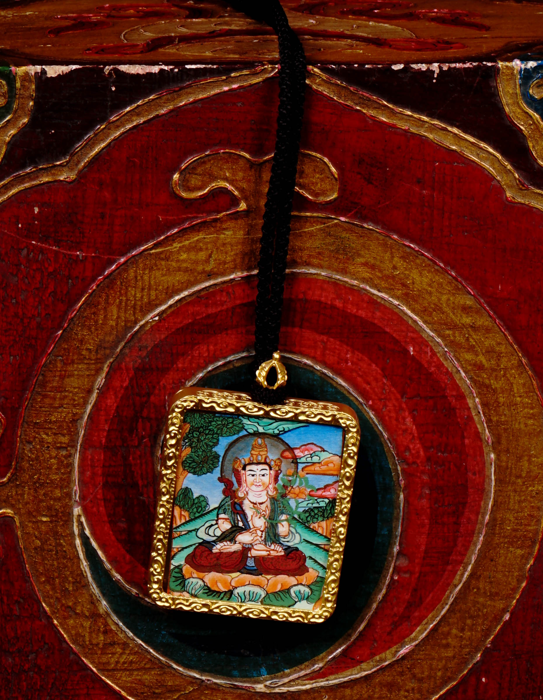 Hand-painted Fushen Fusa Bodhisattva miniature Thangka pendant in gold-accented copper Ghau locket with black beaded cord.
