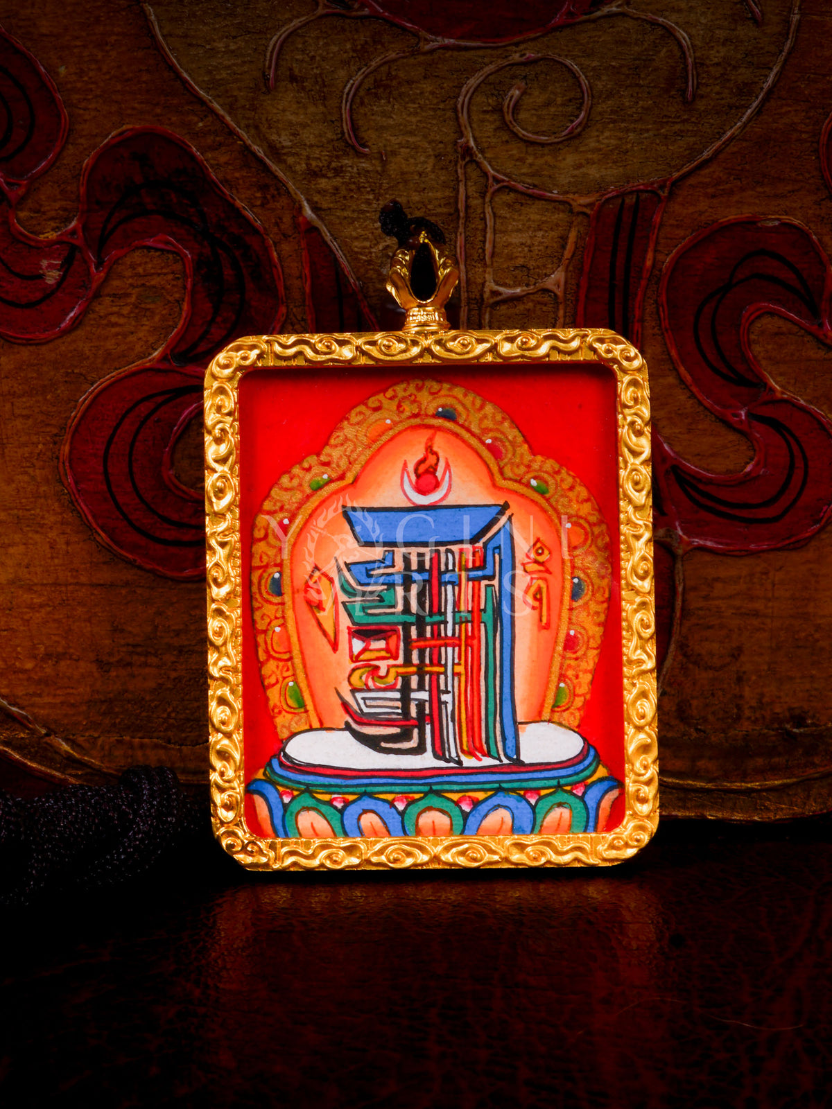Hand-painted Kalachakra Mandala Ghau pendant in a gold-tone frame, handcrafted in Nepal using traditional Himalayan miniature painting techniques.