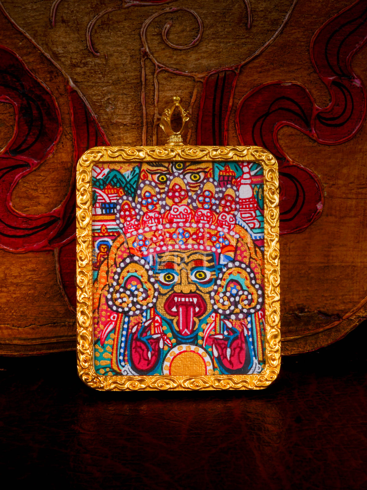 Hand-painted Zhaji Lhamo Ghau pendant in a gold-tone frame, handcrafted in Nepal using traditional Tibetan miniature painting techniques.