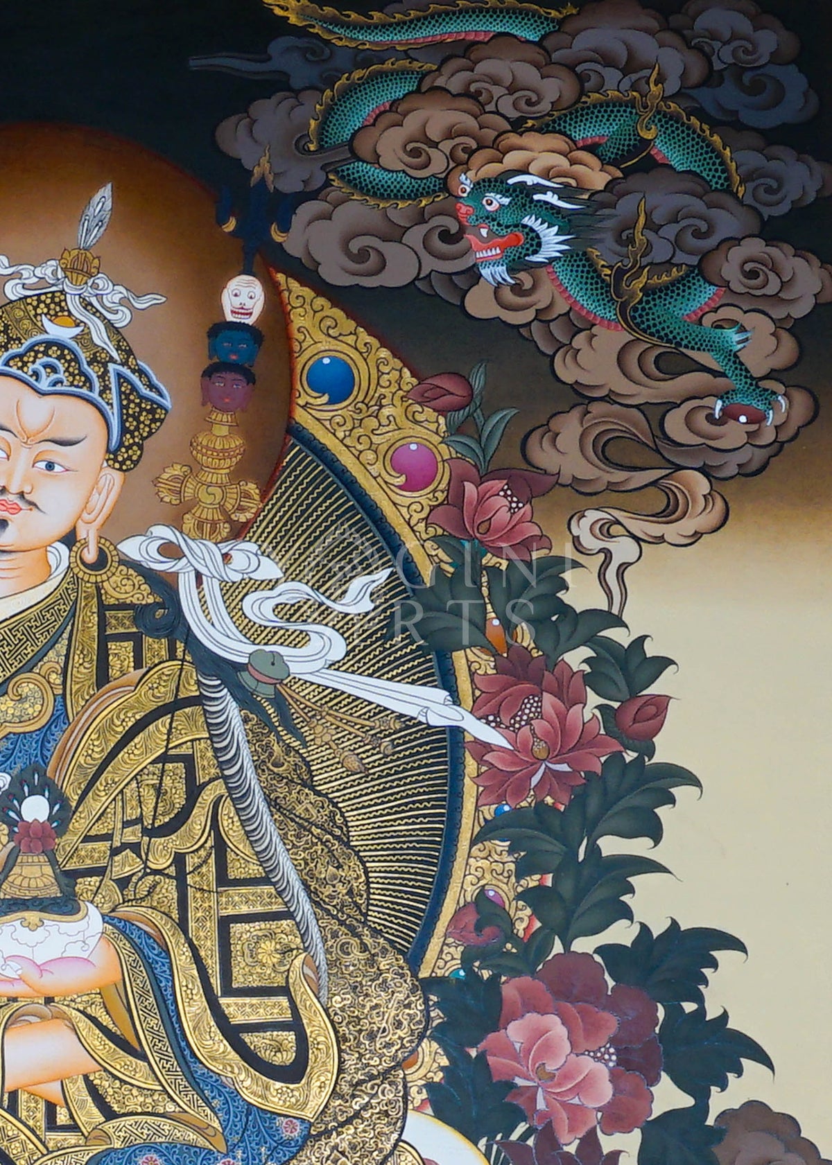 Hand-painted Guru Rinpoche Thangka featuring Guru Padmasambhava with White Tara and Amitayus, natural mineral pigments, gold detailing, and a traditional Himalayan landscape.