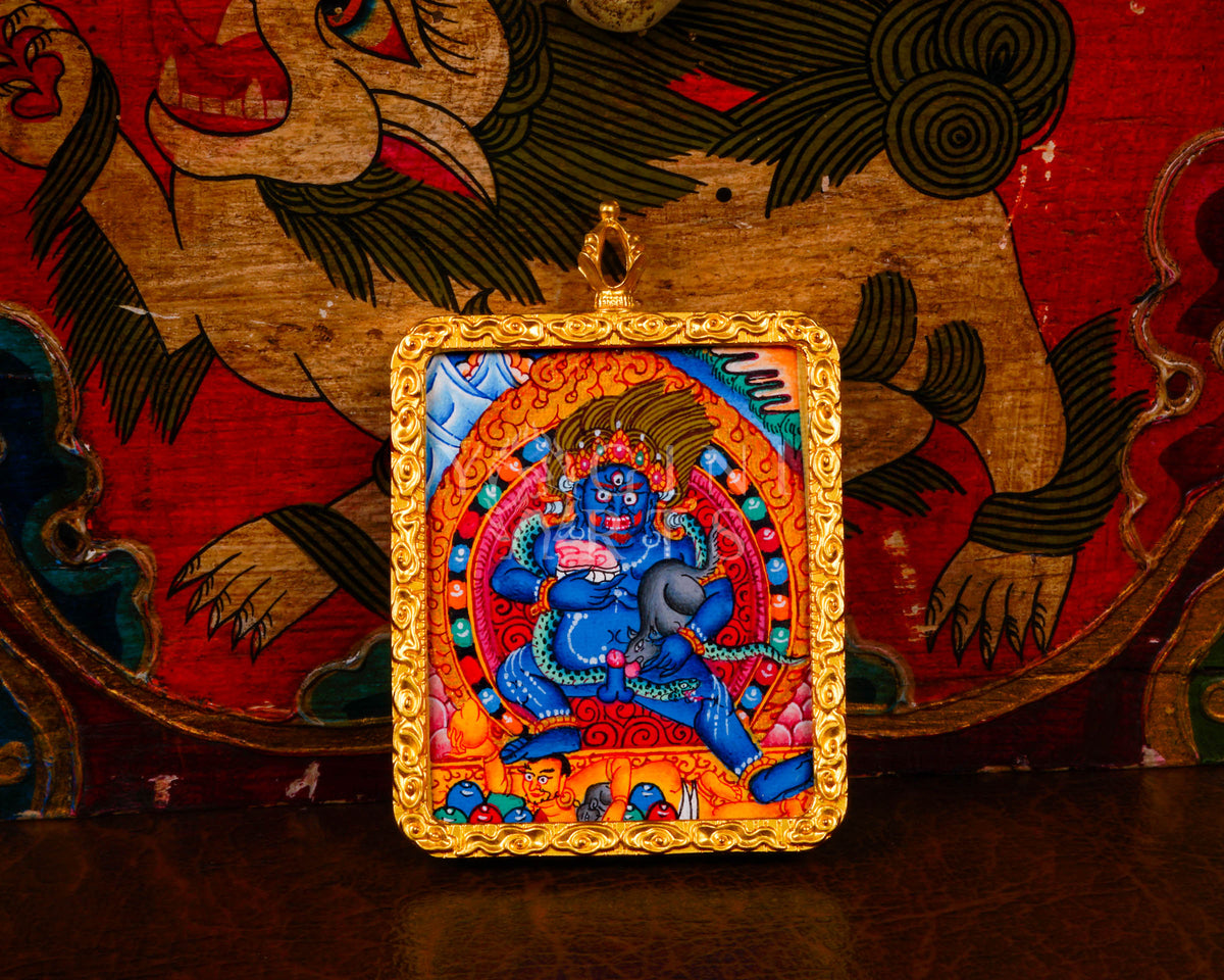 Hand-painted Black Zambhala Ghau pendant in a gold-tone frame, handcrafted in Nepal using traditional Tibetan miniature painting techniques.