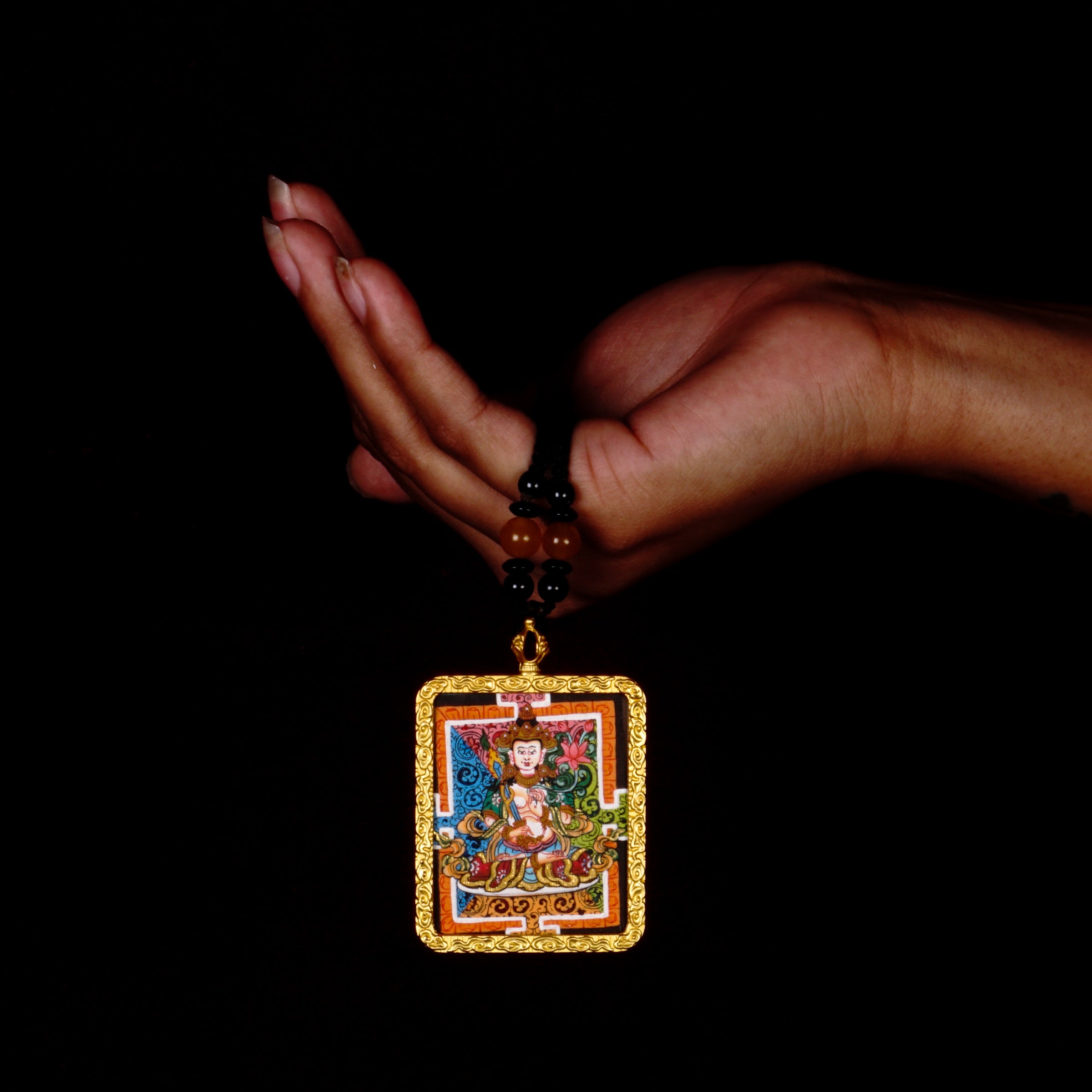 Hand-painted Fushen Fusa miniature Thangka pendant in gold-accented copper Ghau locket with black beaded cord.