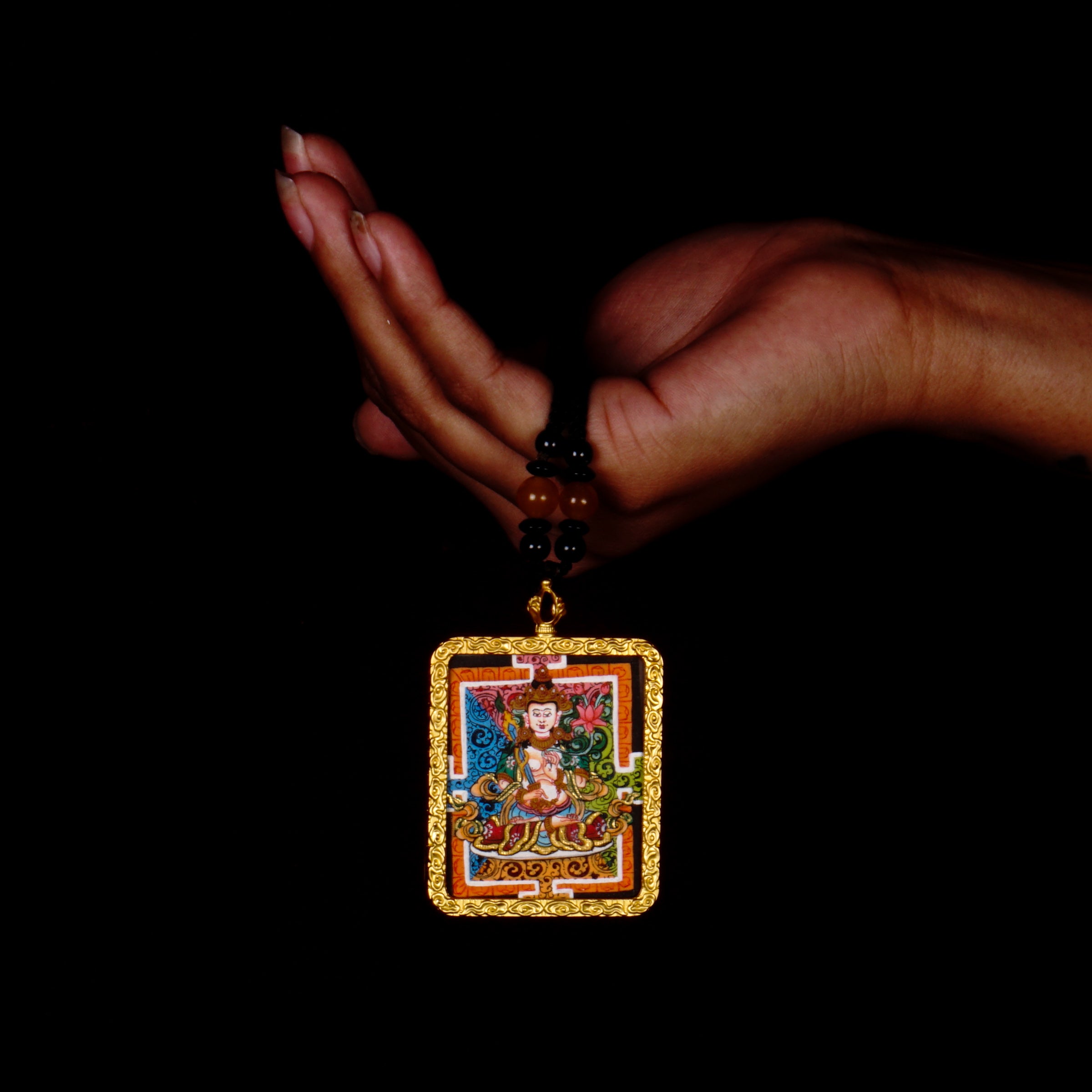 Hand-painted Fushen Fusa miniature Thangka pendant in gold-accented copper Ghau locket with black beaded cord.