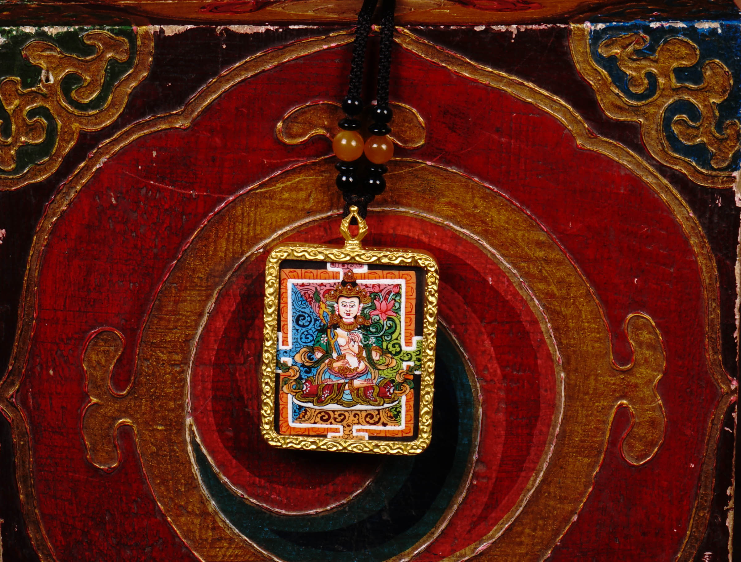 Hand-painted Fushen Fusa miniature Thangka pendant in gold-accented copper Ghau locket with black beaded cord.