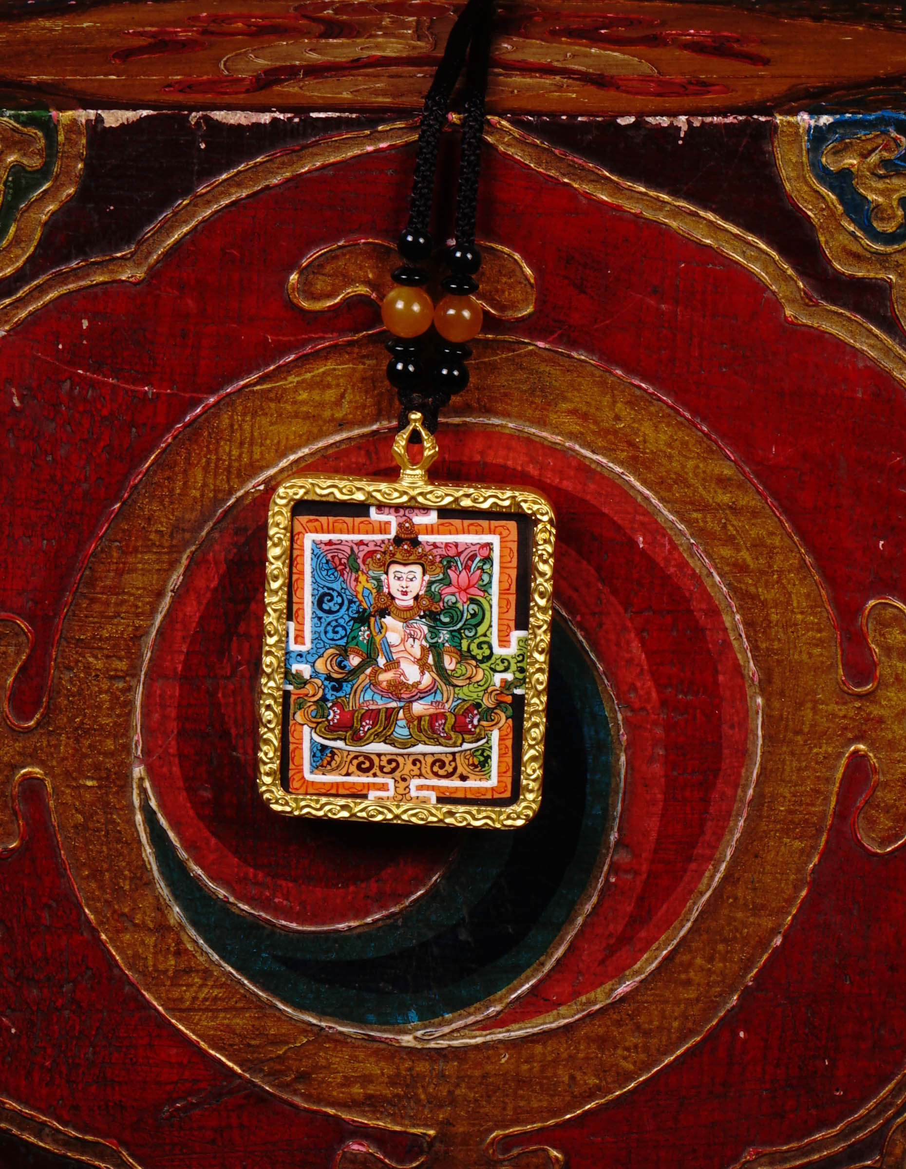 Hand-painted Fushen Fusa miniature Thangka pendant in gold-accented copper Ghau locket with black beaded cord.